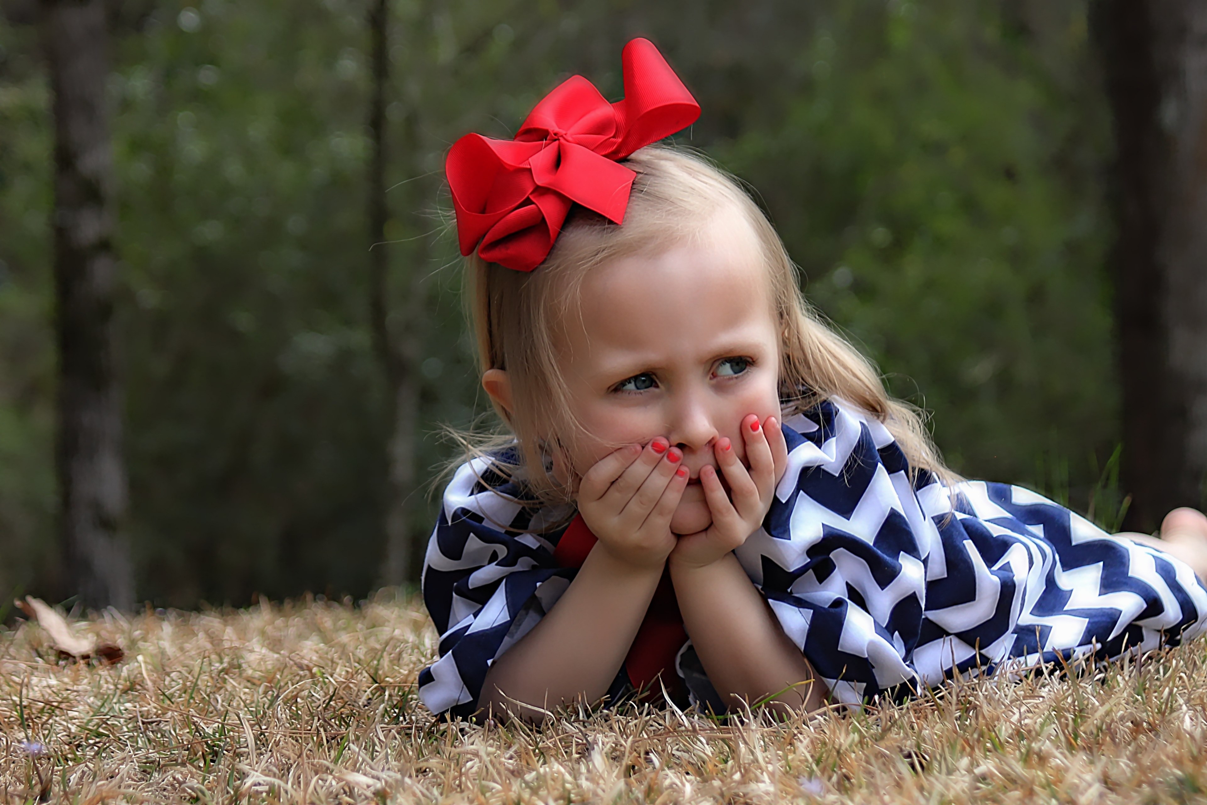 girl child portrait little girl laying down 4k, HD Wallpaper