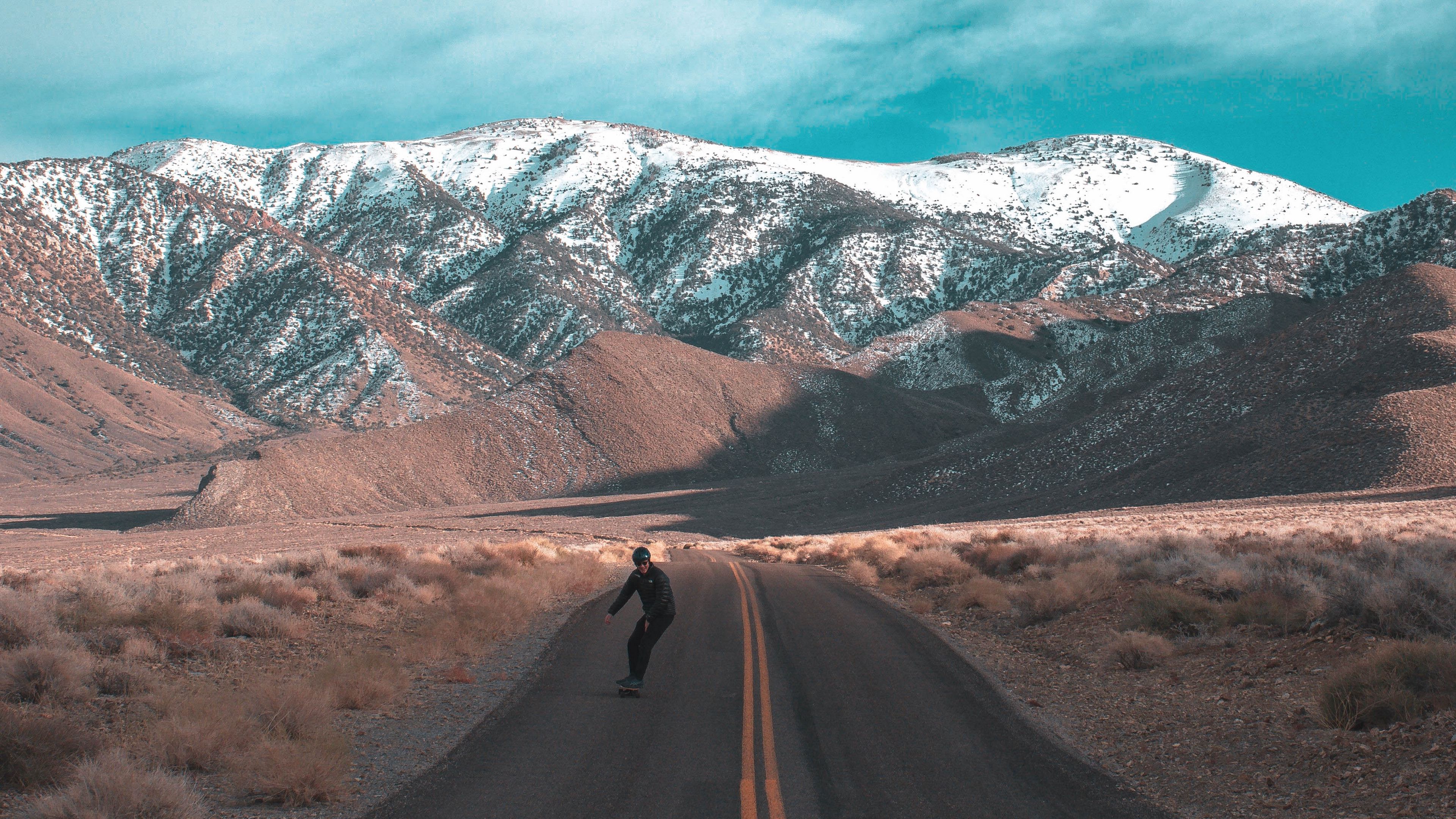 road, skateboarder, skateboard, man, mountains, 4k, HD Wallpaper