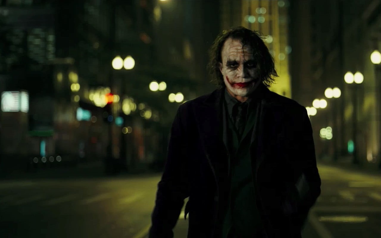 illuminated, architecture, one person, waist up, clothing, standing, night, The Dark Knight, adult, focus on foreground, hairstyle, Heath Ledger, young adult, HD Wallpaper
