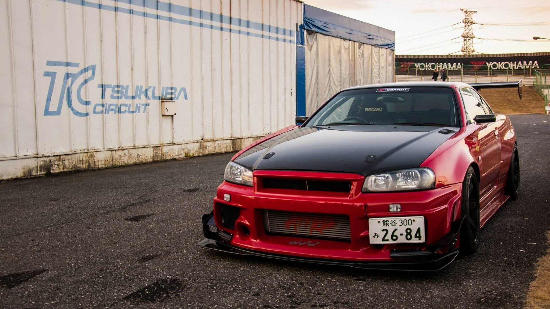 street, land vehicle, Nissan Skyline GT-R R34, mode of transportation, transportation, architecture, red cars, built structure, JDM, no people, communication, HD Wallpaper
