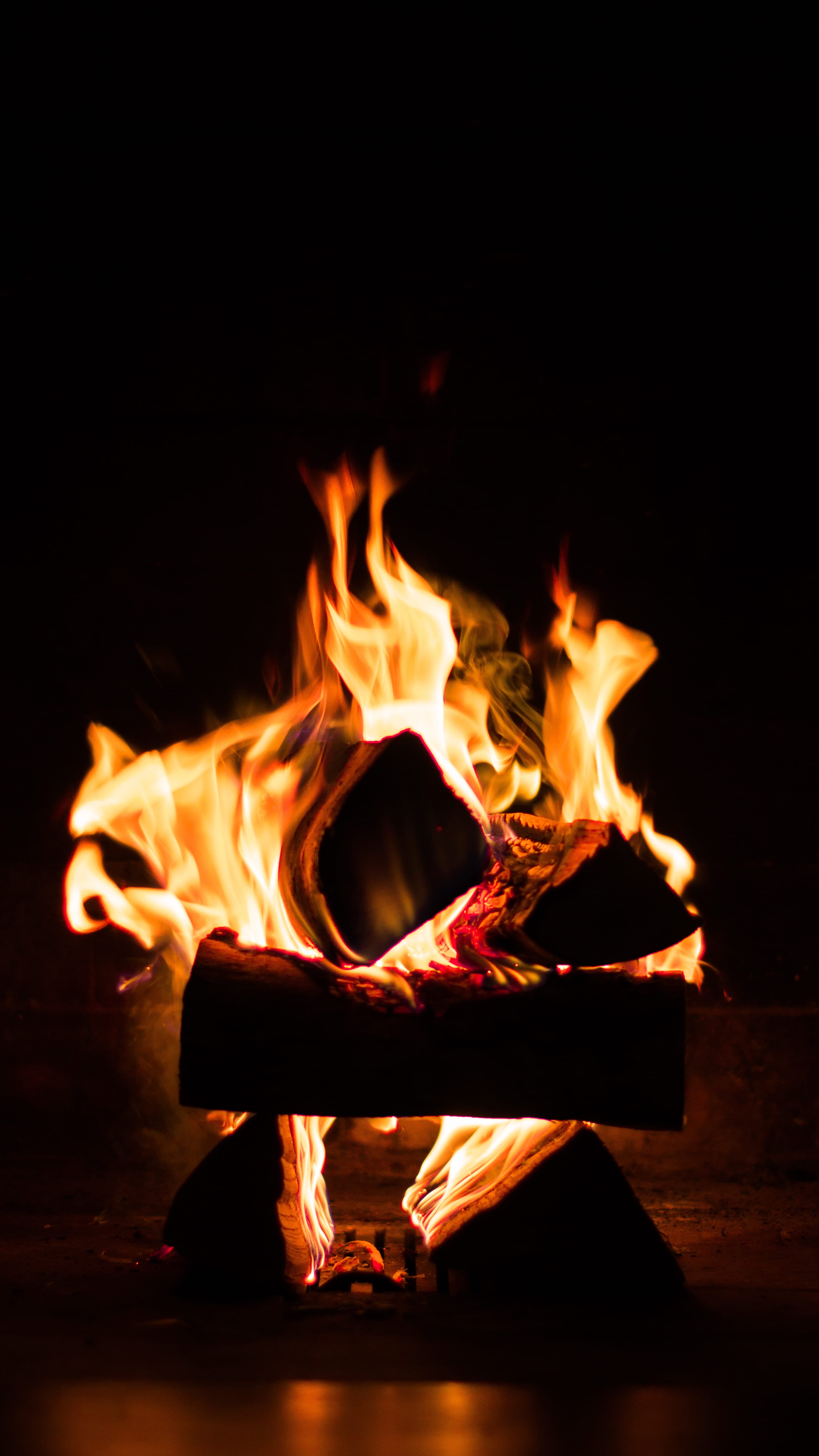 fire, ankle, glowing, log, wood - material, burning, red, black background, nature, person, human, motion, sign, indoors, night, orange color, orange, hearth, Phone HD Wallpaper