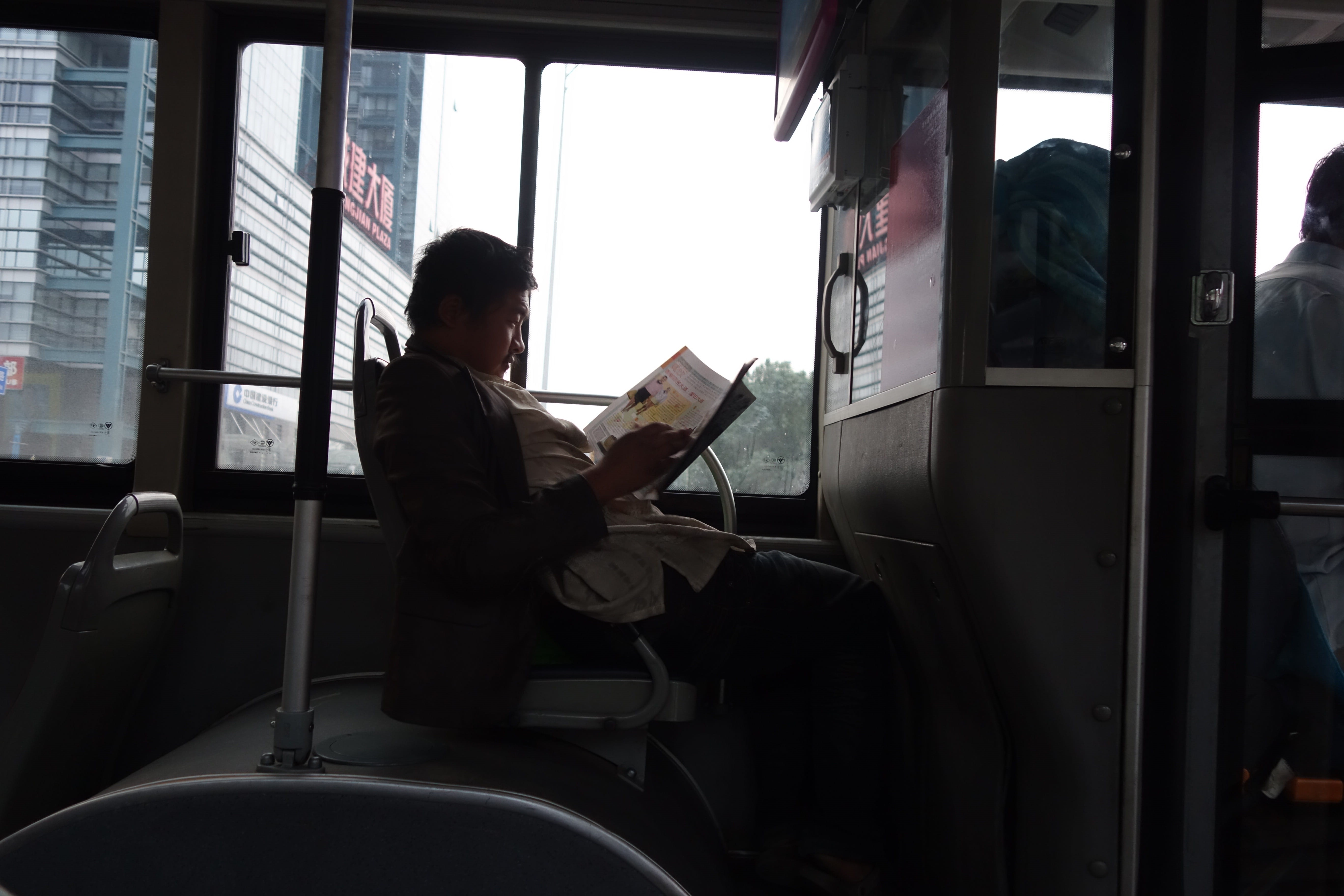 mans books, day, reading in bus, books, cushion, transportation, transparent, person, vehicle interior, reading (quotation subject), land vehicle, 5K, HD Wallpaper