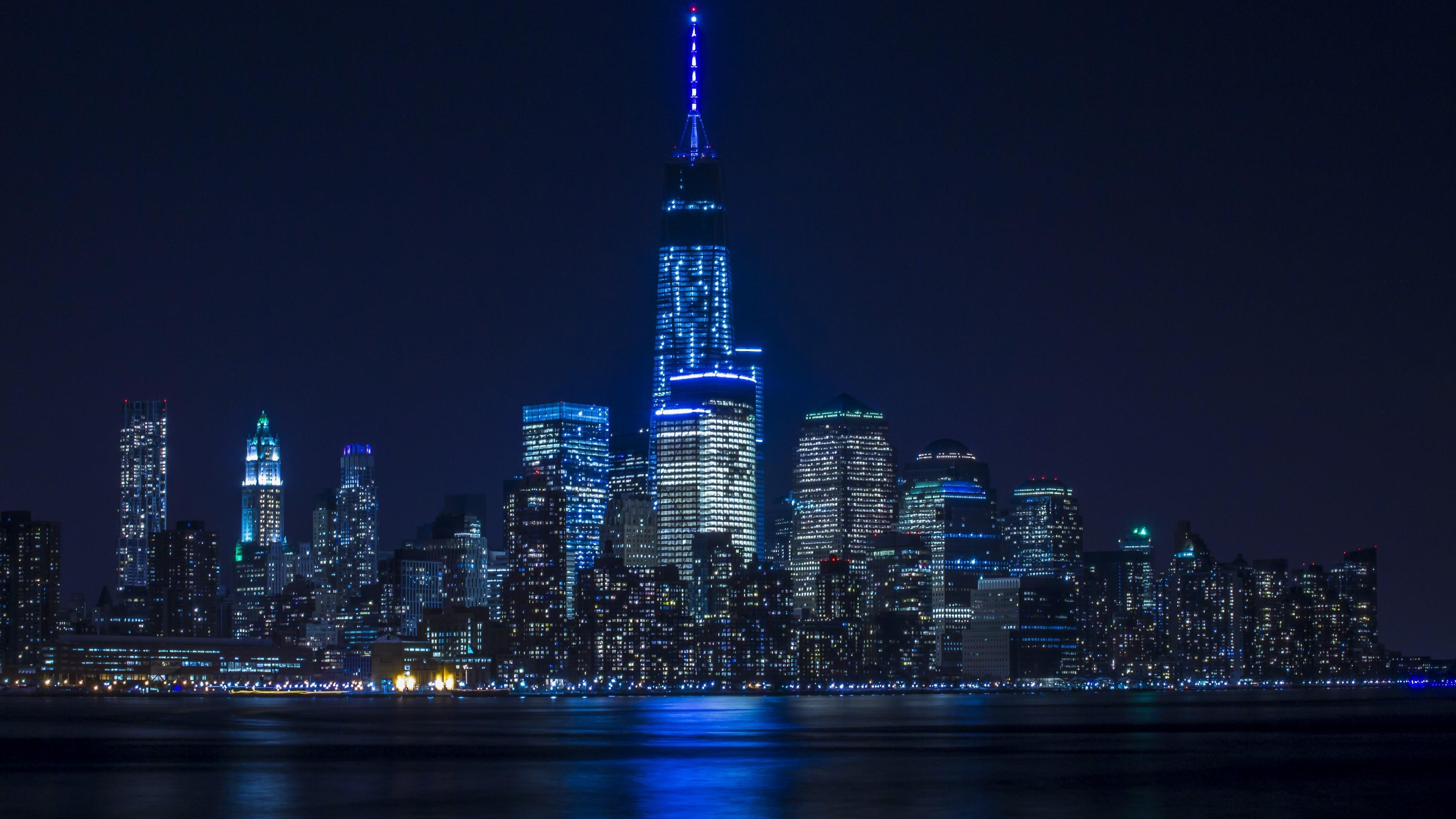 downtown, metropolis, city, skyscraper, water, cityscape, skyline, tower, reflection, 4K, tower block, night, blue lights, architecture, HD Wallpaper