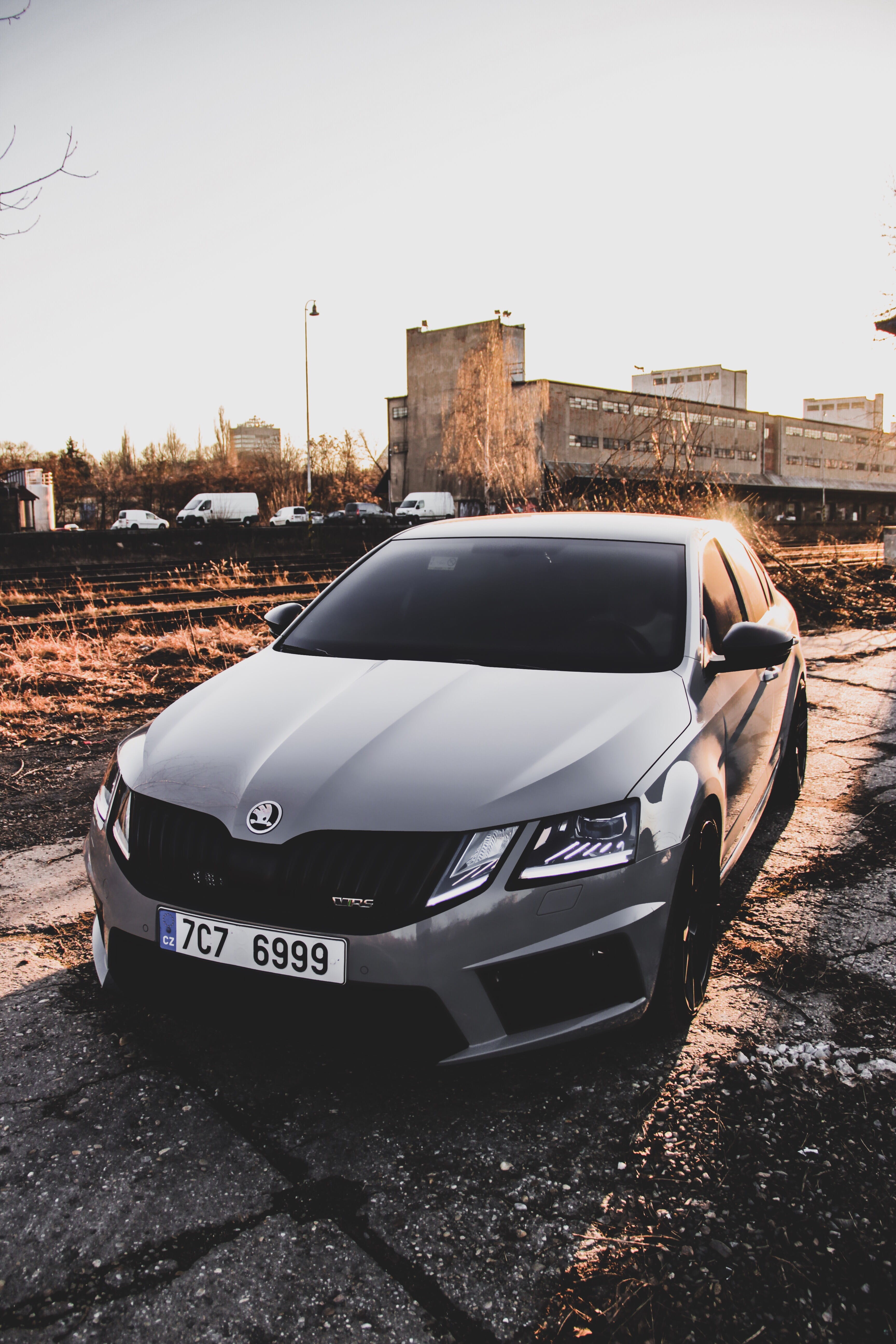 motor vehicle, text, transportation, vehicle, parking, nature, sports car, cars, spoke, architecture, car wheel, skoda, car, 5K, day, sky, land vehicle, Phone HD Wallpaper