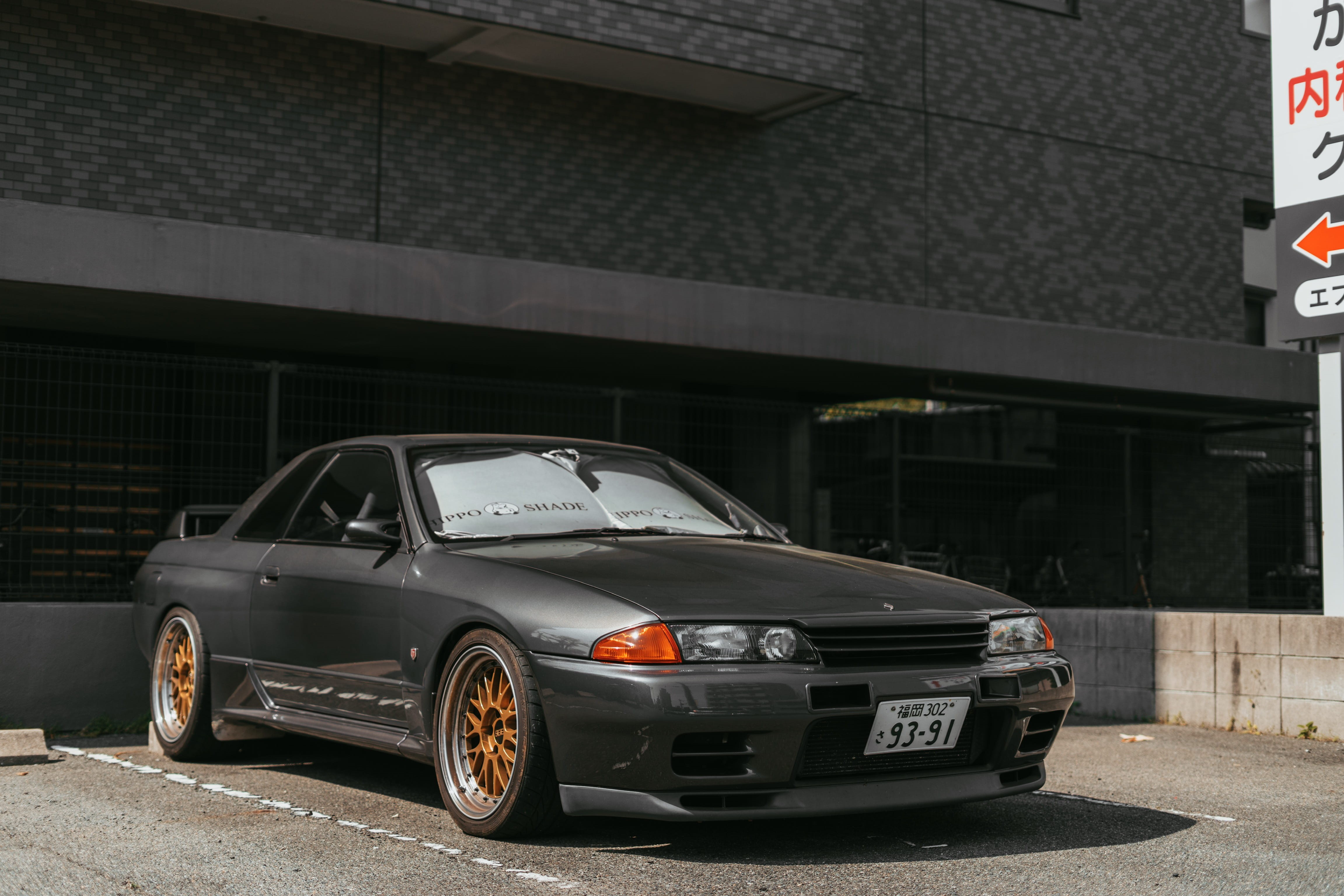 japanese car, motor vehicle, spoke, 4K, nature, gtr, outdoors, no people, city, road, vehicle, building exterior, car wheel, building, automobile, wheel, HD Wallpaper