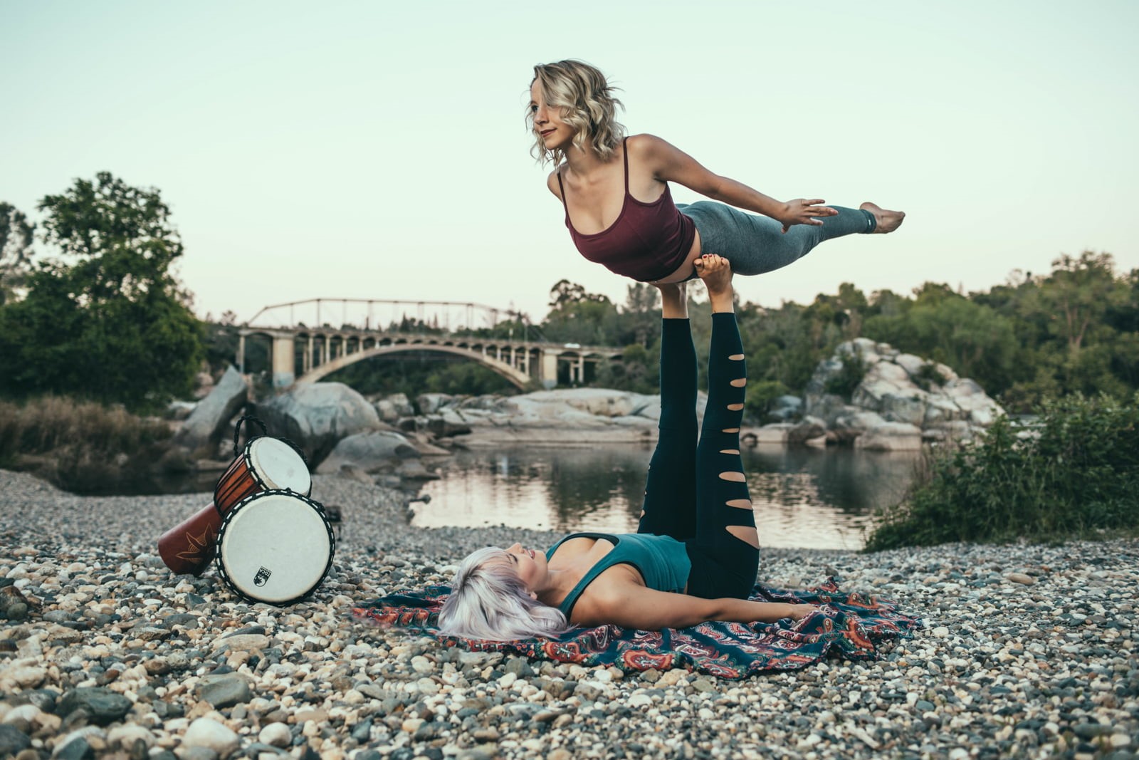 young women, depth of field, leisure activity, focus on foreground, day, top, bridge, 720P, lake, rocks, women outdoors, balance, full length, nature, HD Wallpaper