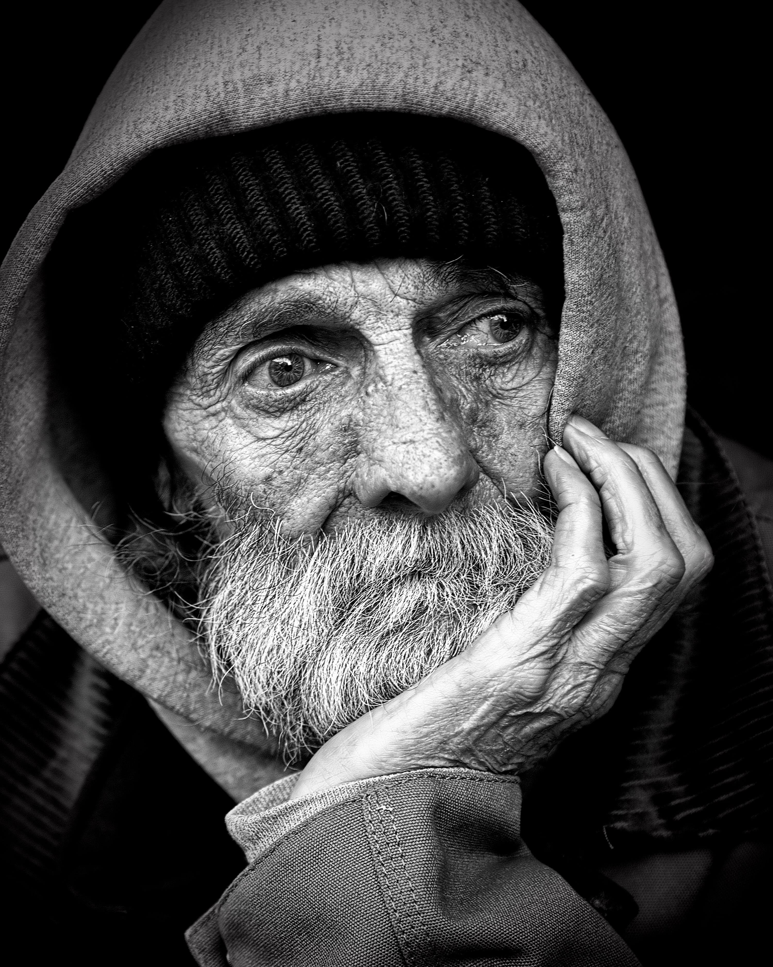 2K, males, hat, clothing, poor, forties, primate, black background, human body part, real people, charity, photo, services, issue, shelter, beggar, man, Phone HD Wallpaper
