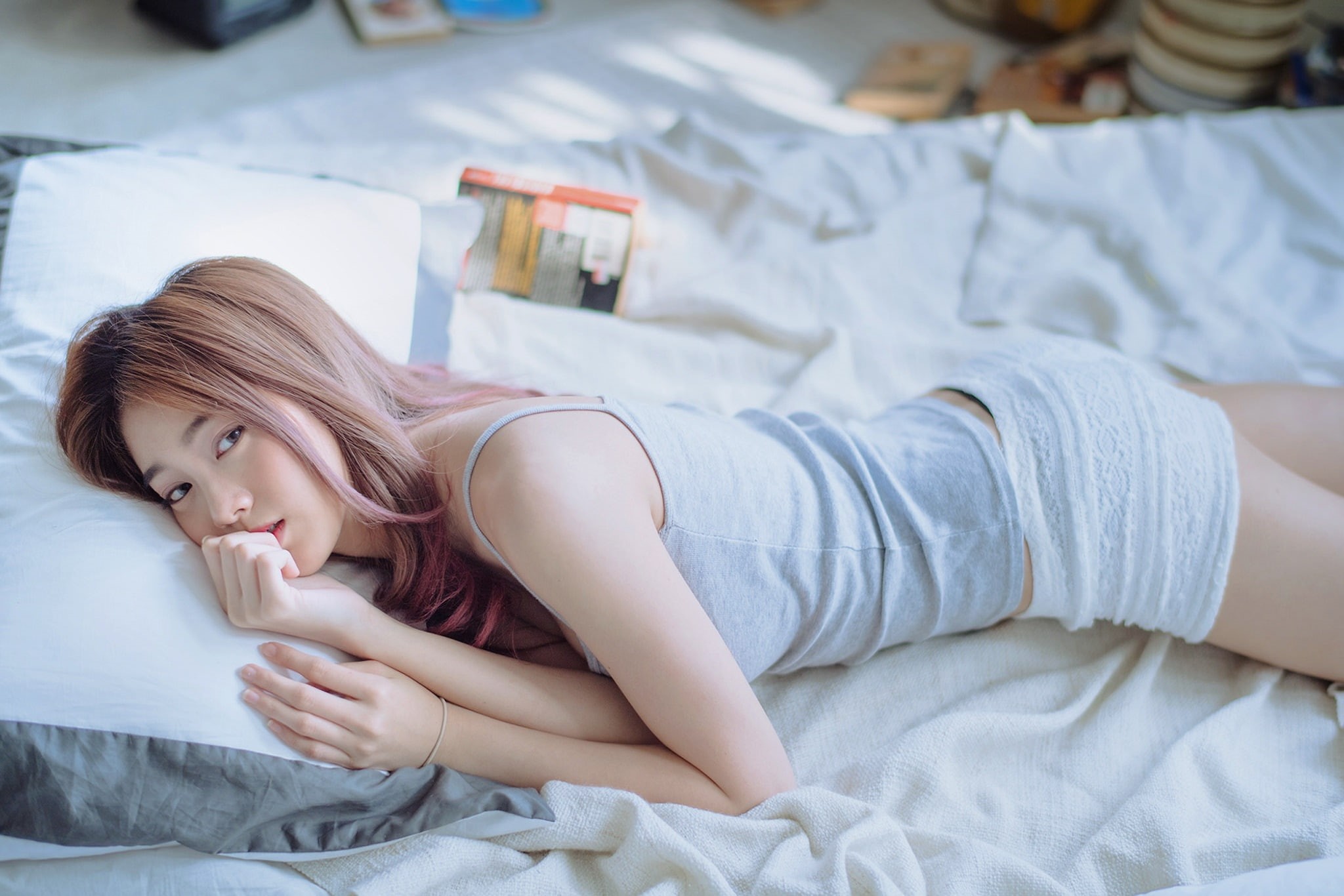 women, sheet, hair, lying on front, depth of field, looking at viewer, Asian, furniture, hairstyle, lifestyles, indoors, grey tops, model, lying down, short shorts, HD Wallpaper