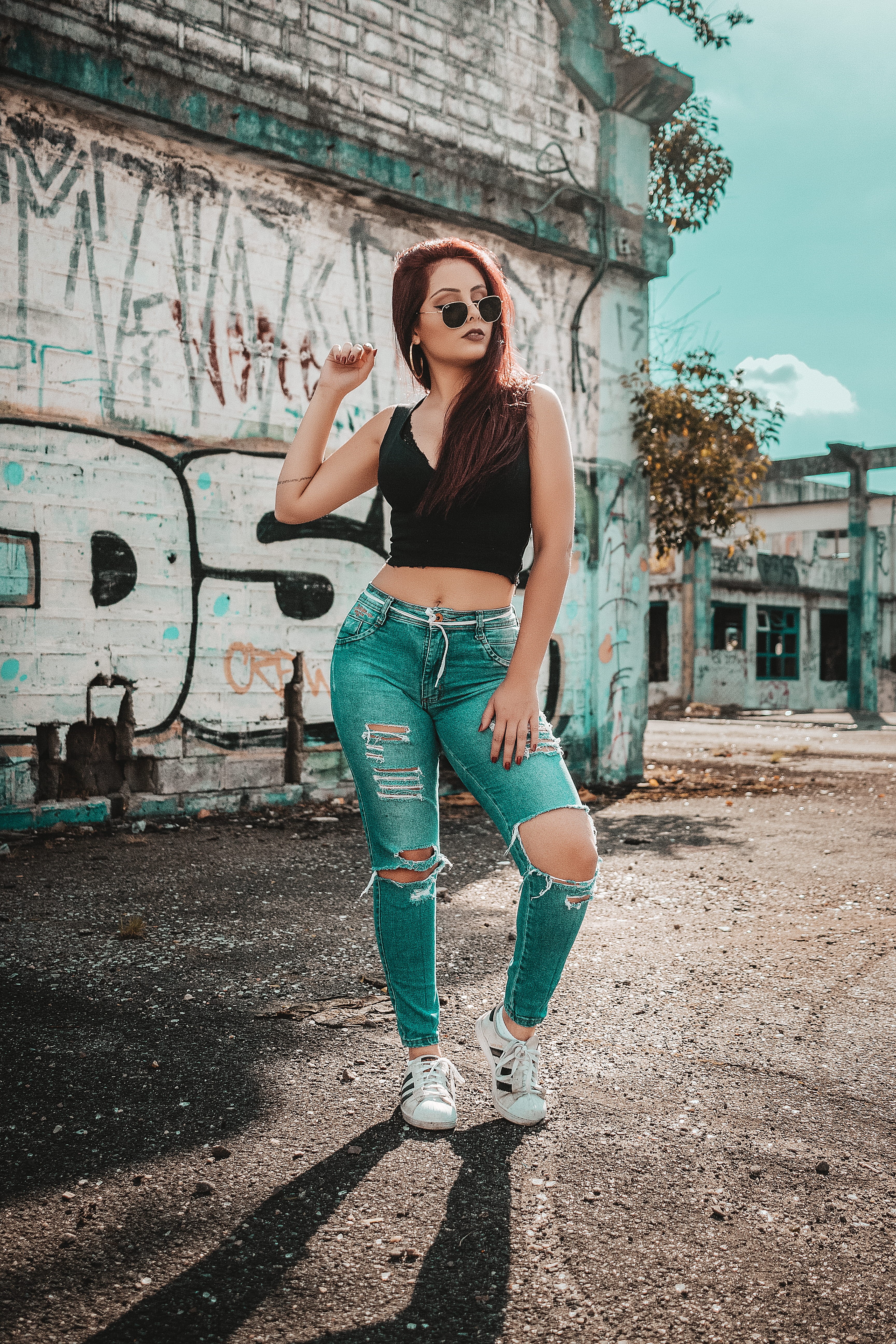 top, lifestyles, building exterior, female, girl, blue, 5K, black, sunlight, jeans, outfit, sleeveless, fashion, daytime, abandoned, near, hairstyle, building, Phone HD Wallpaper