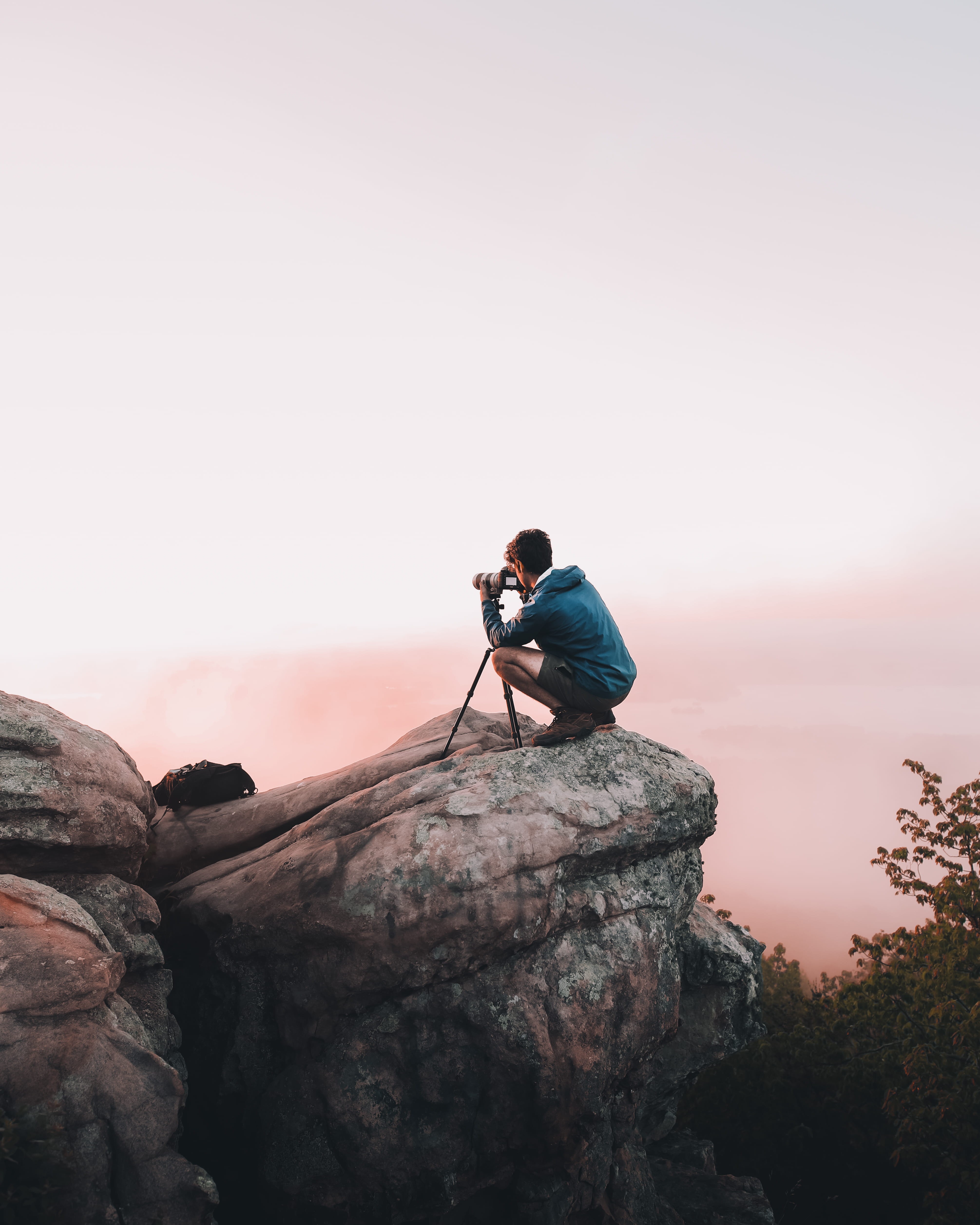 man, rock formation, men, view, young adult, cliff, teal, backpacking, young men, clear sky, nature, jacket, sitting, sunset, side view, one person, sunrise, Phone HD Wallpaper