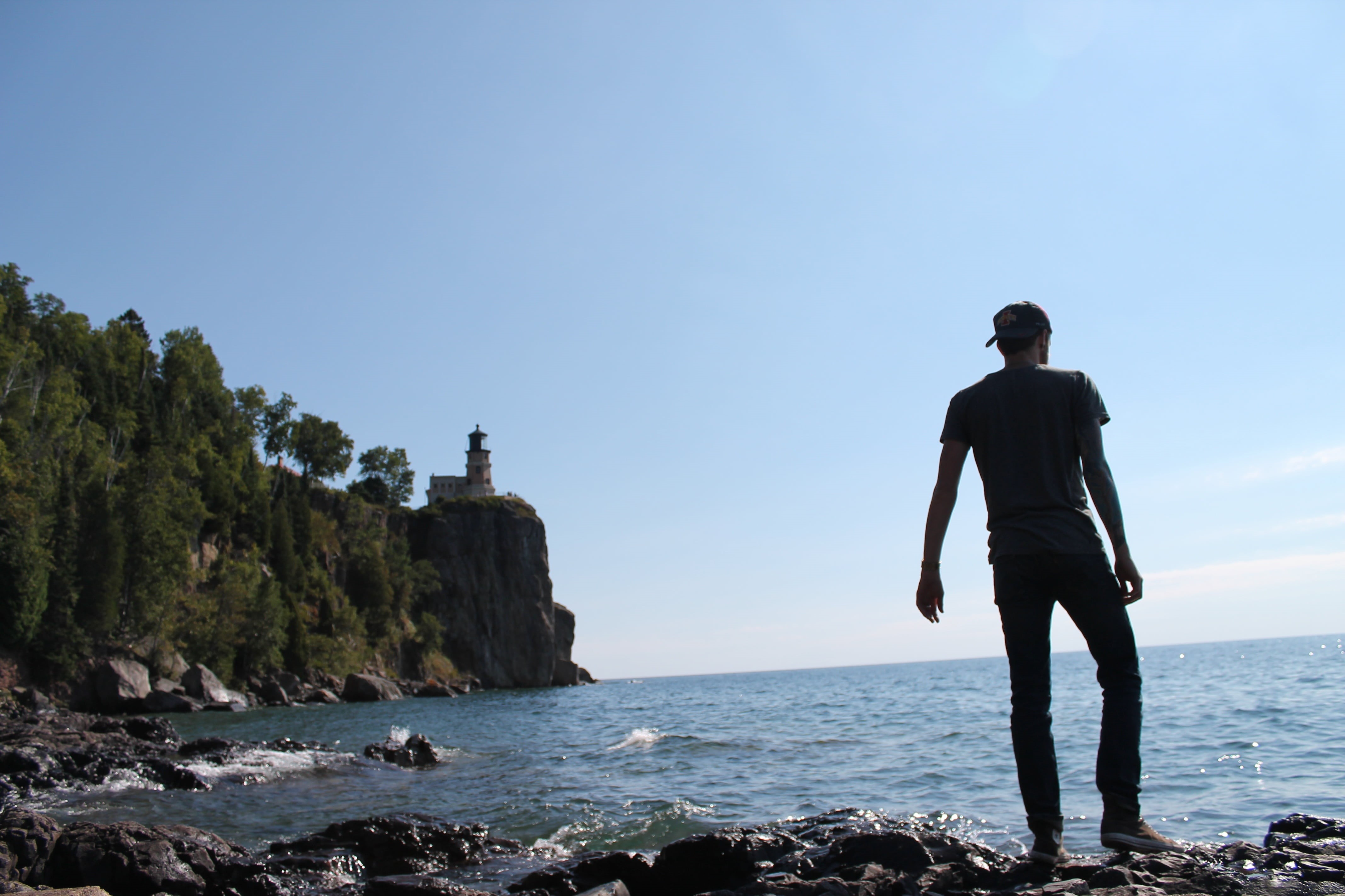 vacations, outdoors, real people, sky, rocks, scenics - nature, ocean, rock, one man only, vacation, one person, man, summer, guy, alone, landscape, water, HD Wallpaper