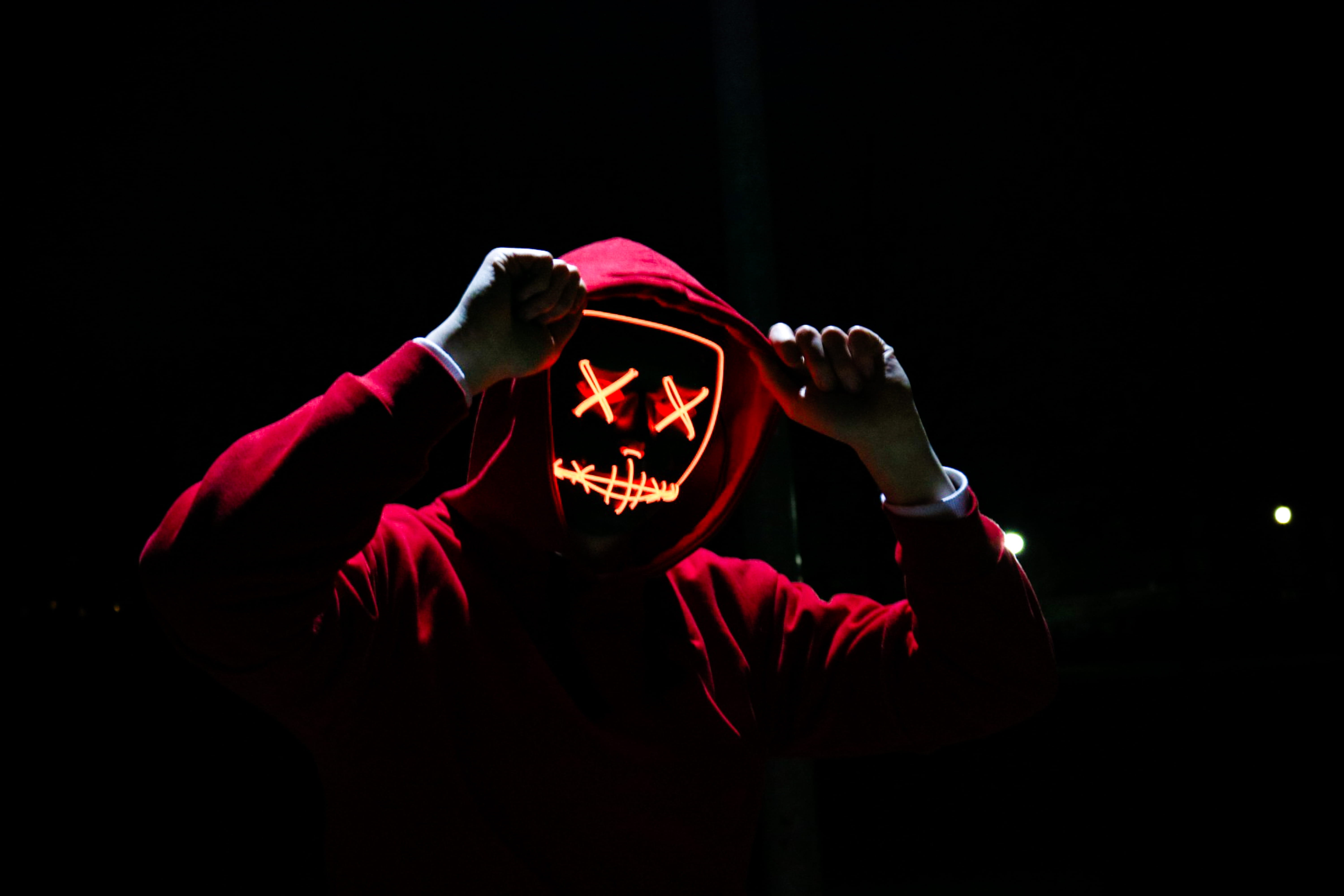 one person, adult, young adult, night, hood, arms raised, celebration, front view, waist up, red, face, person, portrait, halloween, illuminated, holding, HD Wallpaper