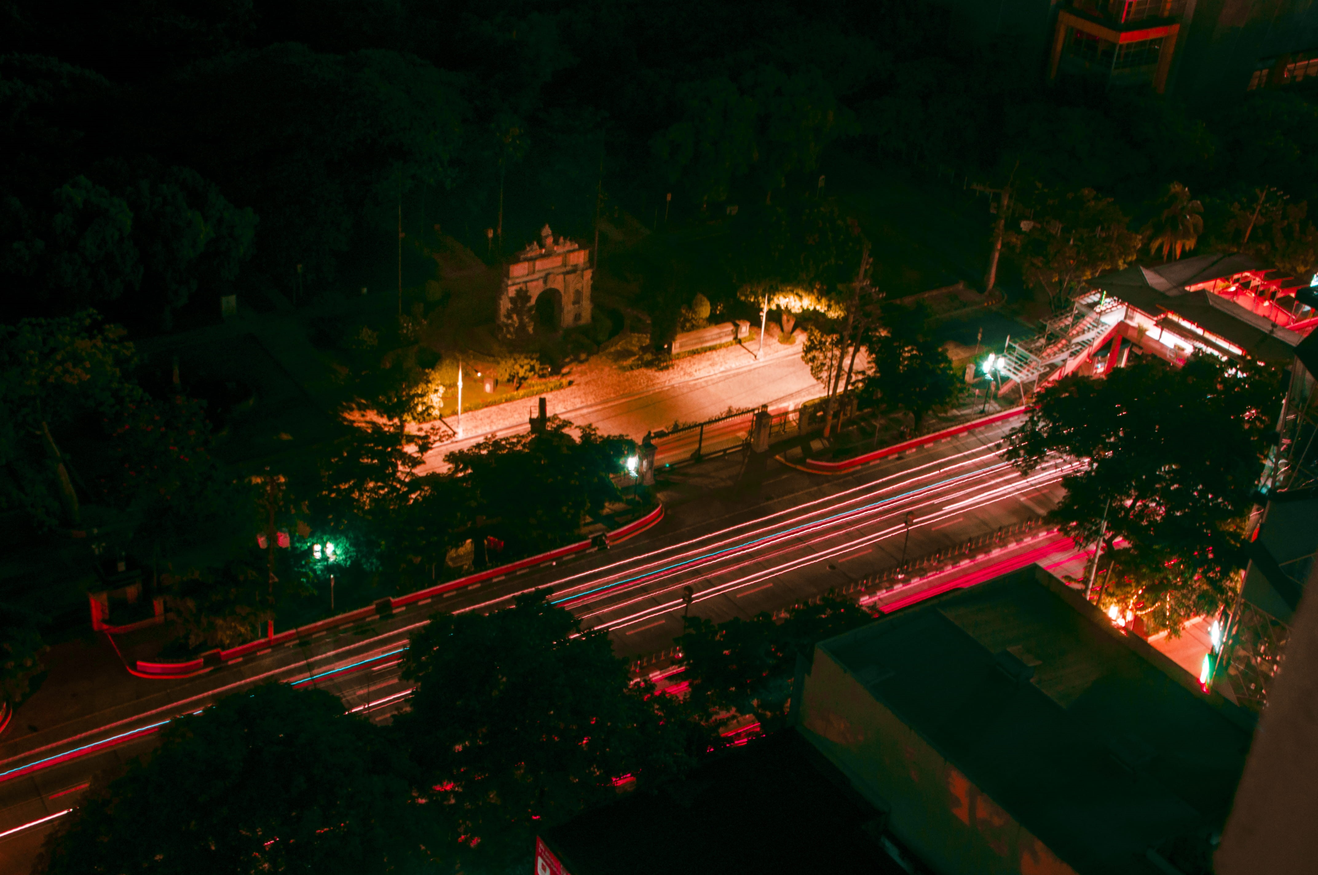transportation, motion, blurred motion, tree, trees, rooftop, arch of the centuries, architecture, long exposure, night, street, light trail, manila, city life, HD Wallpaper