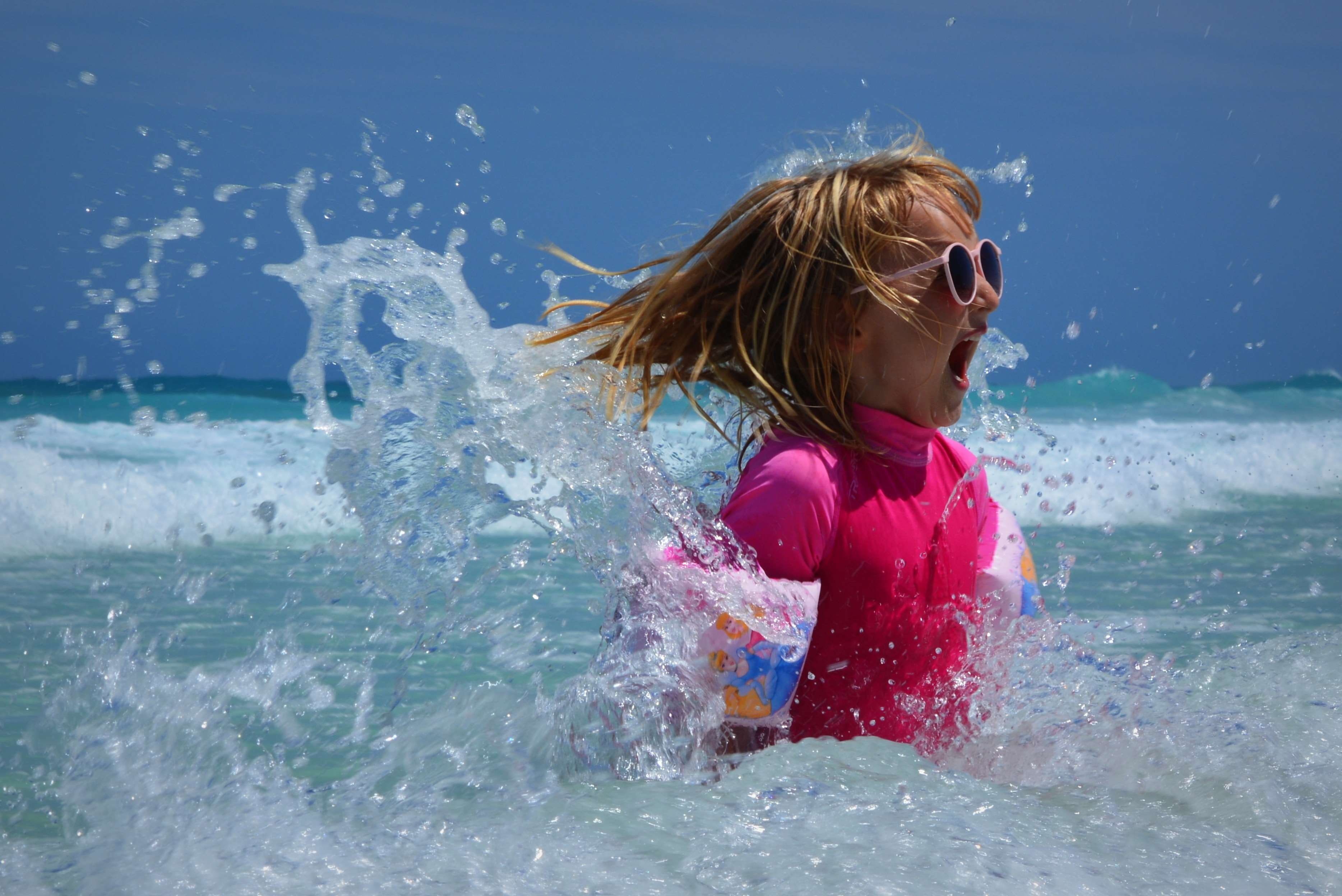 sunglasses, sea, outdoors, childhood, waves, motion, fun, offspring, ocean, pink, one person, spetters, hair, expression, leisure activity, lifestyles, HD Wallpaper