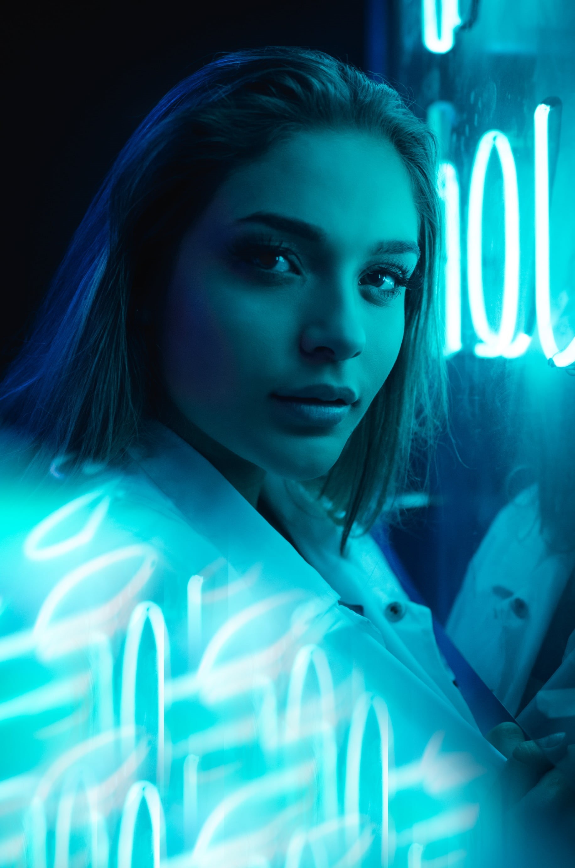 beautiful woman, hairstyle, adult, illuminated, portrait, young adult, studio shot, neon glow, women, black background, beauty, dark, 2K, contemplation, Phone HD Wallpaper