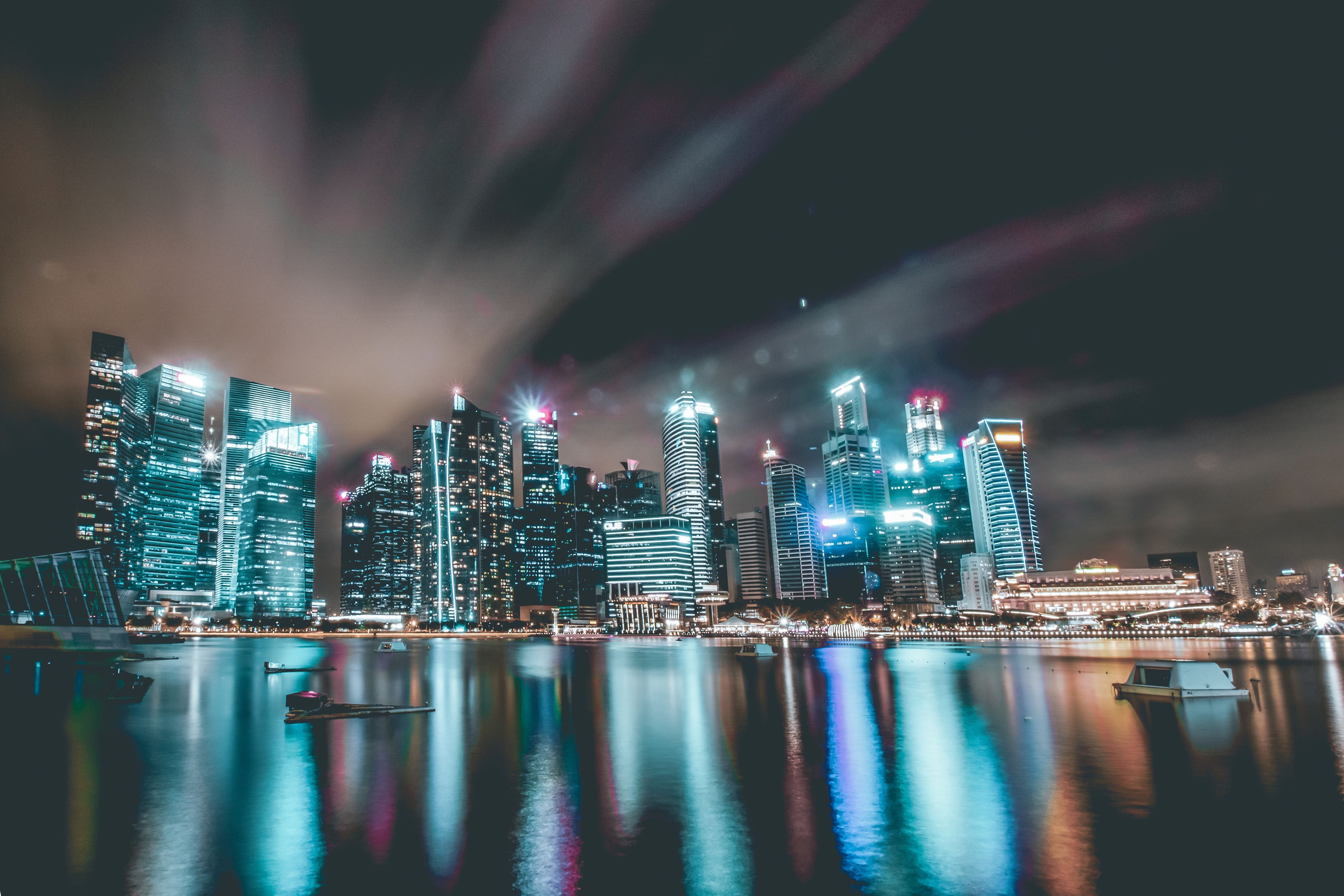 famous skyline, illuminated, bay, no people, skyline, office building exterior, city, modern, light, laser, waterfront, reflection, building, sky, cityscape, HD Wallpaper