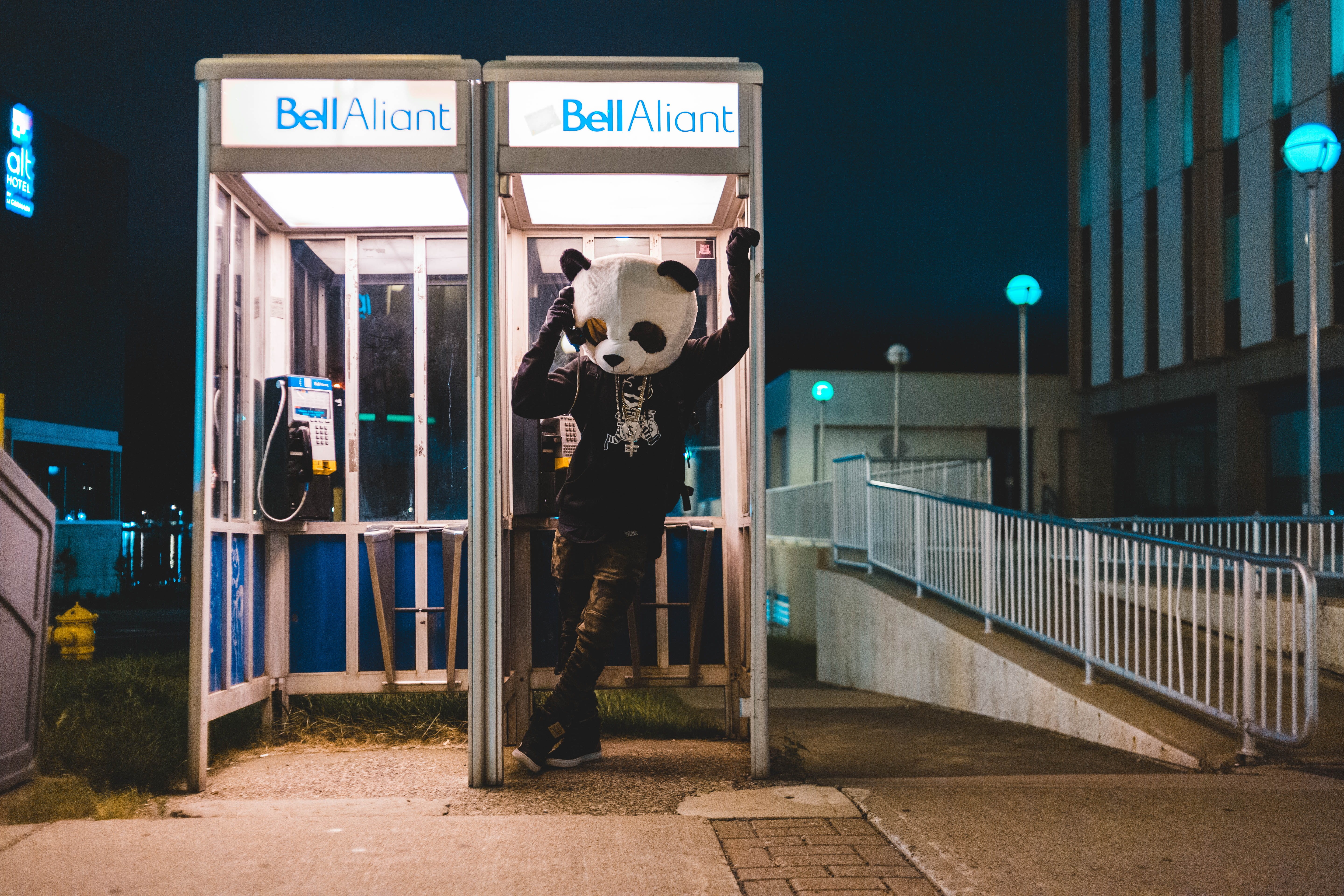 illuminated, leisure activity, lifestyles, city, grime, street, wearing, panda, bear, surreal, real people, people, booth, mask, sign, standing, western script, HD Wallpaper