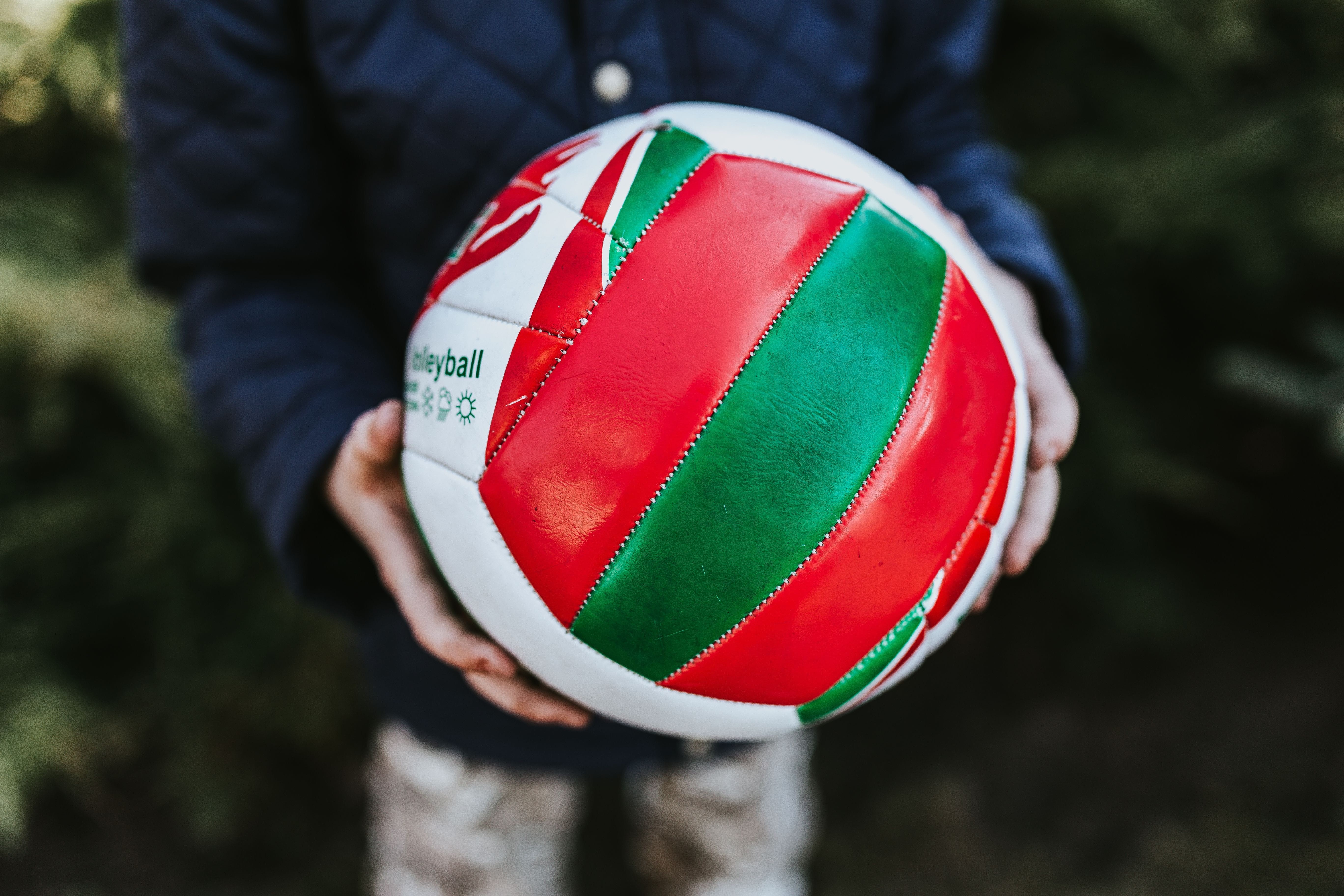 one person, standing, rubiks cube, caucasian Ethnicity, day, sport, ball, jacket, red, holding, real people, casual clothing, playing, human limb, human body part, HD Wallpaper