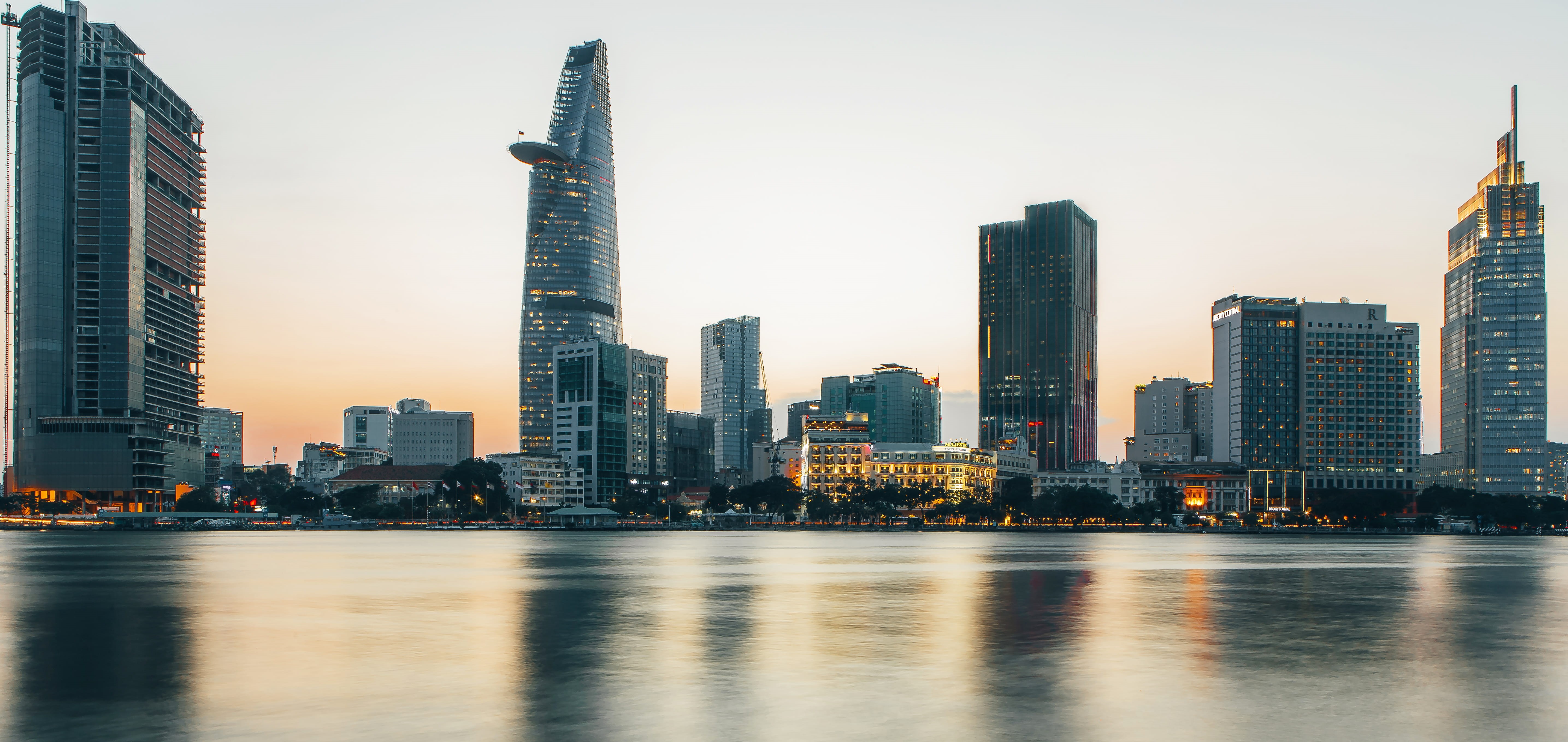 sunset, water, 5K, built structure, apartment building, building exterior, cityscape, building, reflection, hochiminh, long exposure, steeple, spire, financial district, HD Wallpaper