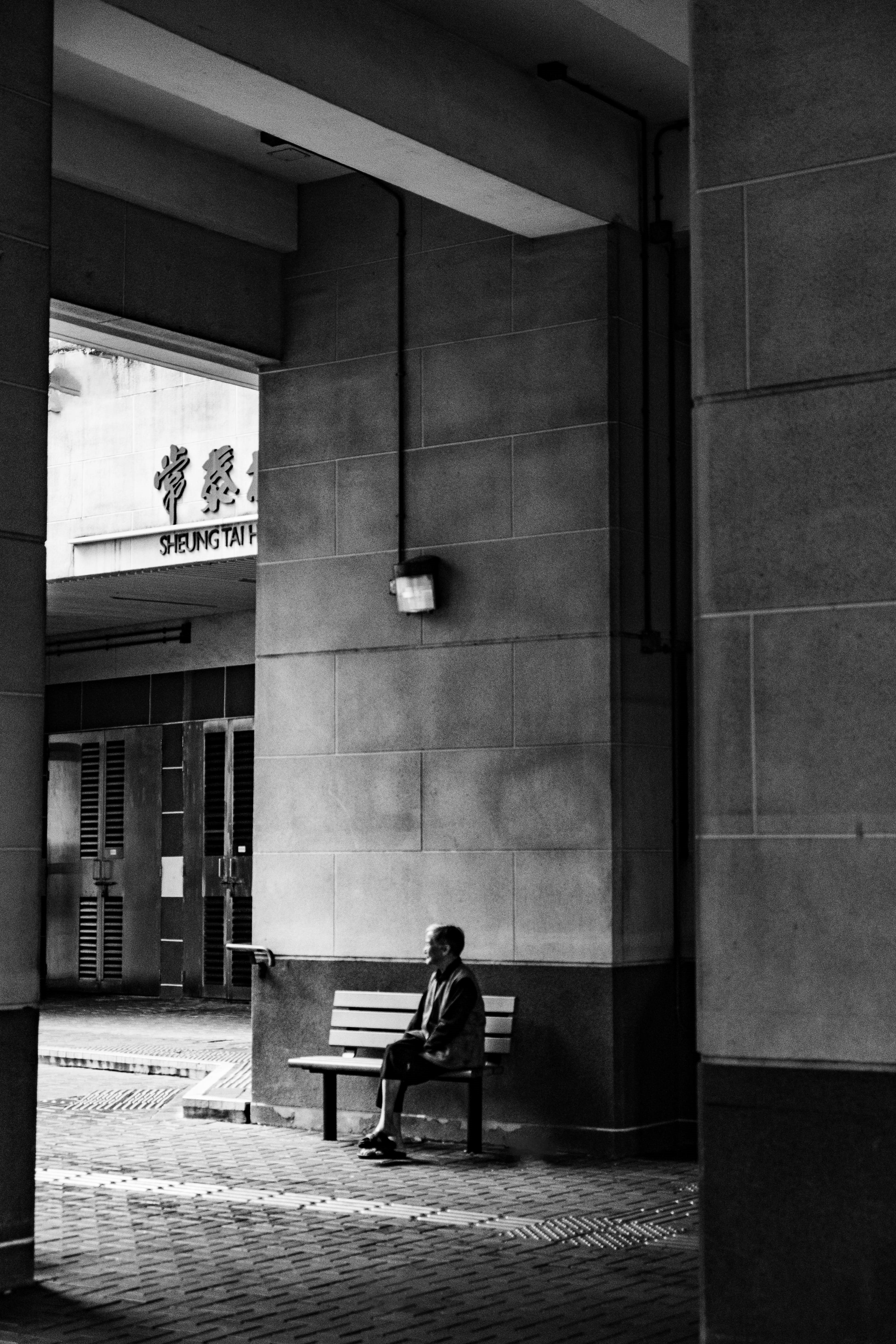 building exterior, rear view, alone, day, sitting, social issues, built structure, full length, kowloon bay, wall - building feature, architecture, lifestyles, Phone HD Wallpaper