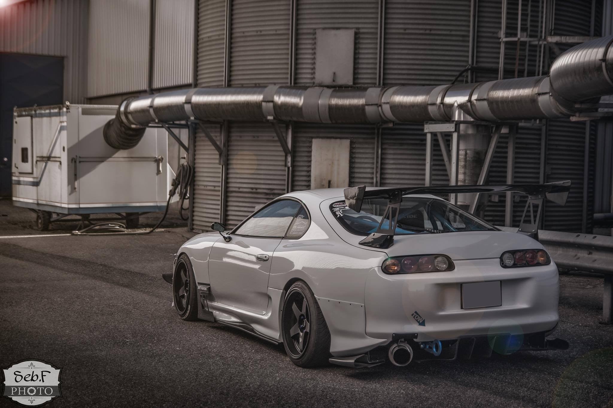 parking, car, transportation, silver colored, 1080P, coupe, land vehicle, city, pipe - tube, architecture, built structure, outdoors, day, toyota, stationary, HD Wallpaper