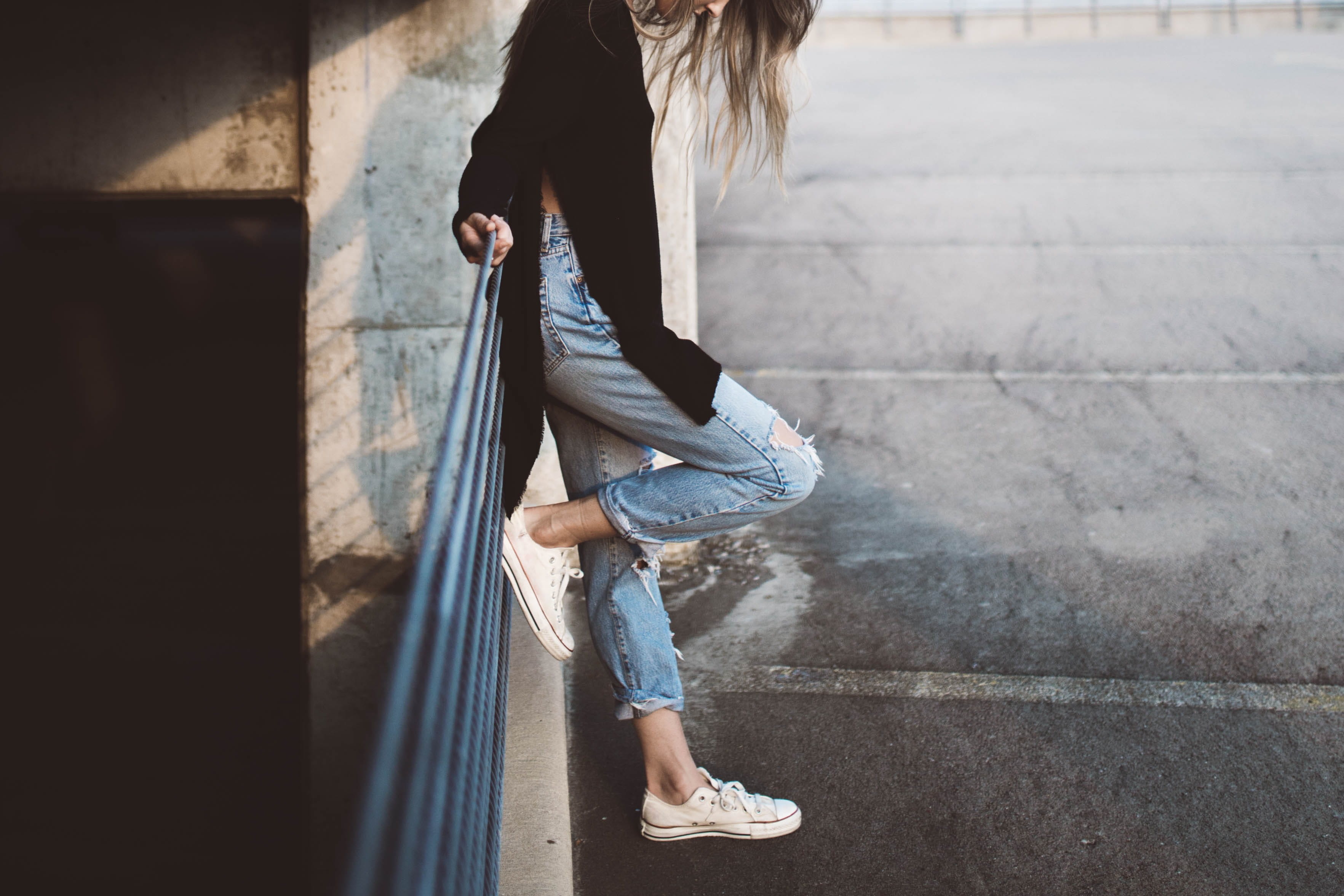 shoe, city Life, real people, steps, long hair, white, blue jeans, one Person, standing, hair, outdoors, sleeve, downward, women, side view, sneakers, fence, HD Wallpaper