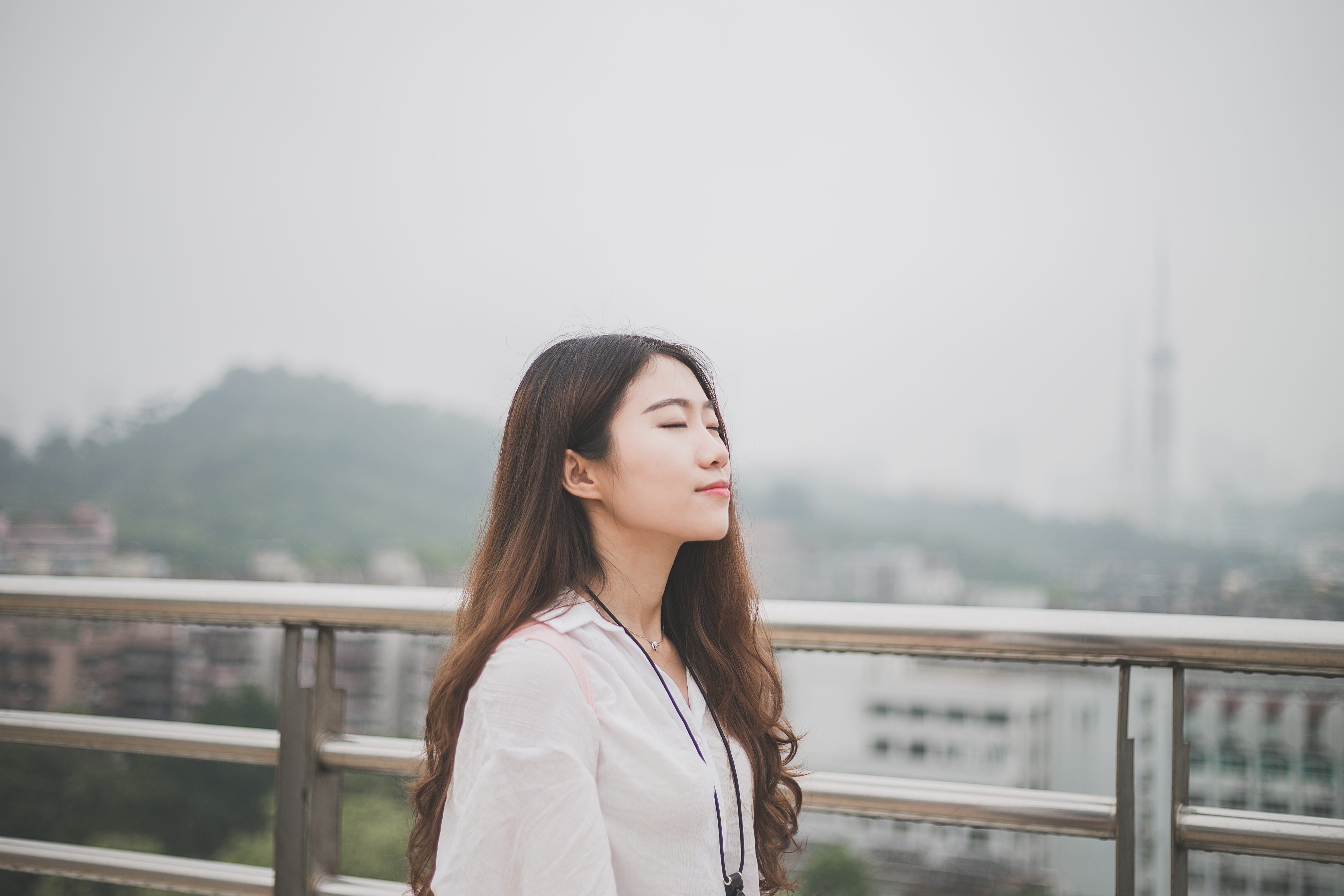 day, focus on foreground, nature, top, rail, white, hairstyle, beautiful woman, adult, beside, bridge - man made structure, eyes closed, one woman only, HD Wallpaper