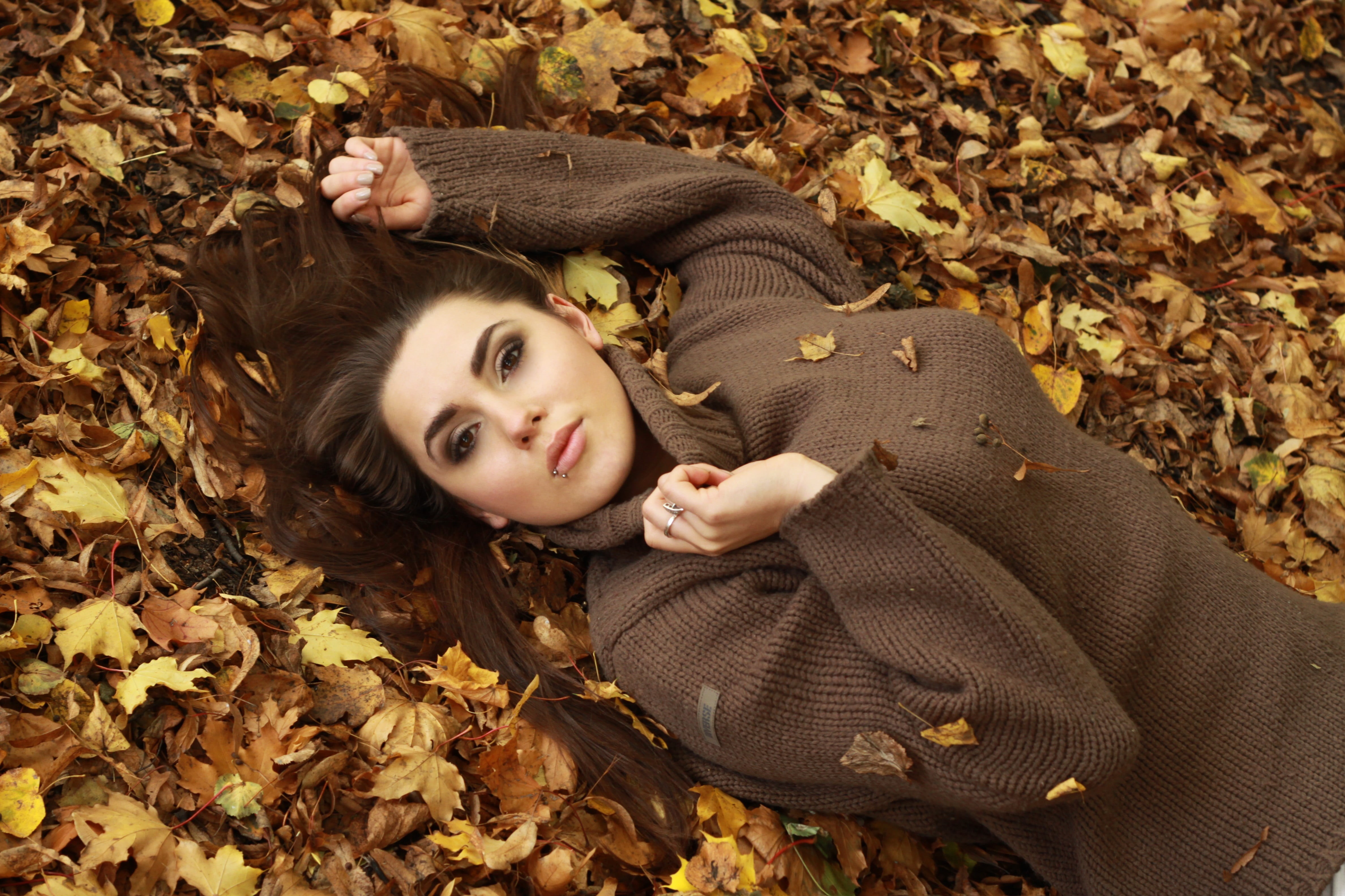 top view, outdoors, fallen leaves, leaf, young adult, rings, women, nature, fall, sweater, autumn, 4K, plant part, beautiful woman, young women, women outdoors, HD Wallpaper