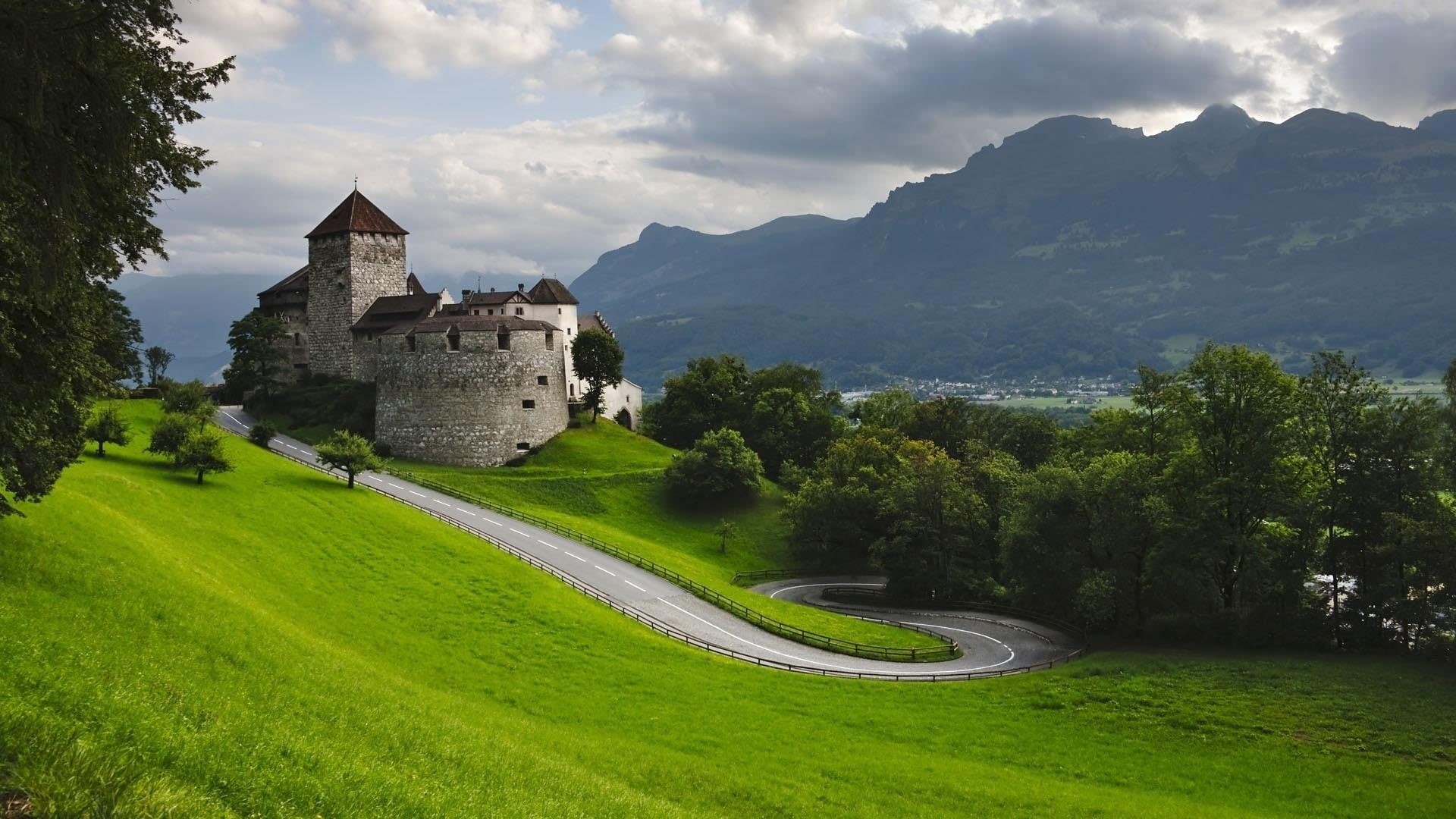 castle, field, Liechtenstein, travel destinations, outdoors, building exterior, nature, hairpin turns, hills, road, history, grass, plant, the past, trees, HD Wallpaper