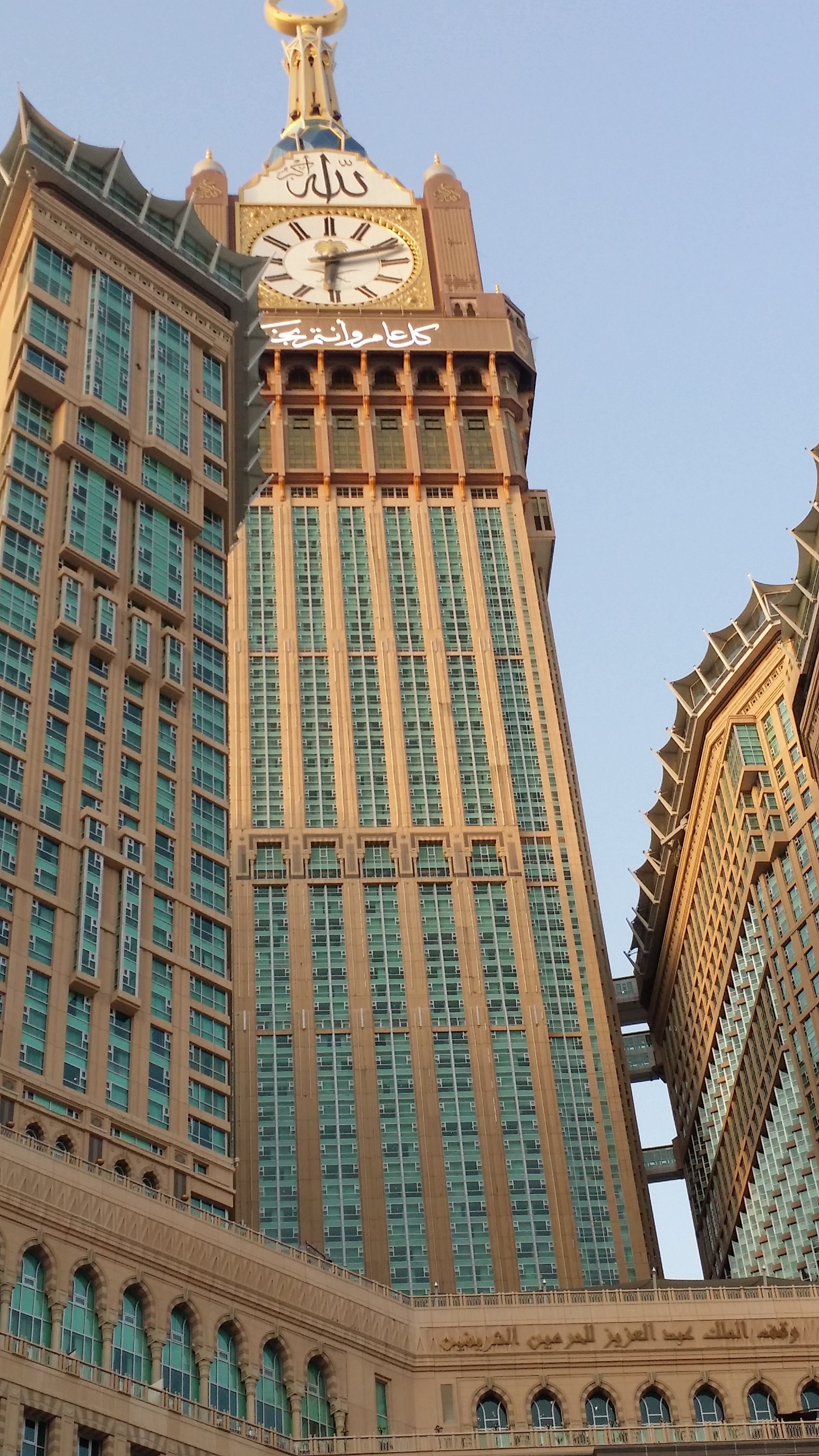 belief, outdoors, office building exterior, city, low angle view, religion, skyscraper, sky, saudi arabia, spirituality, daytime, clock, day, the clock tower in makkah, Phone HD Wallpaper