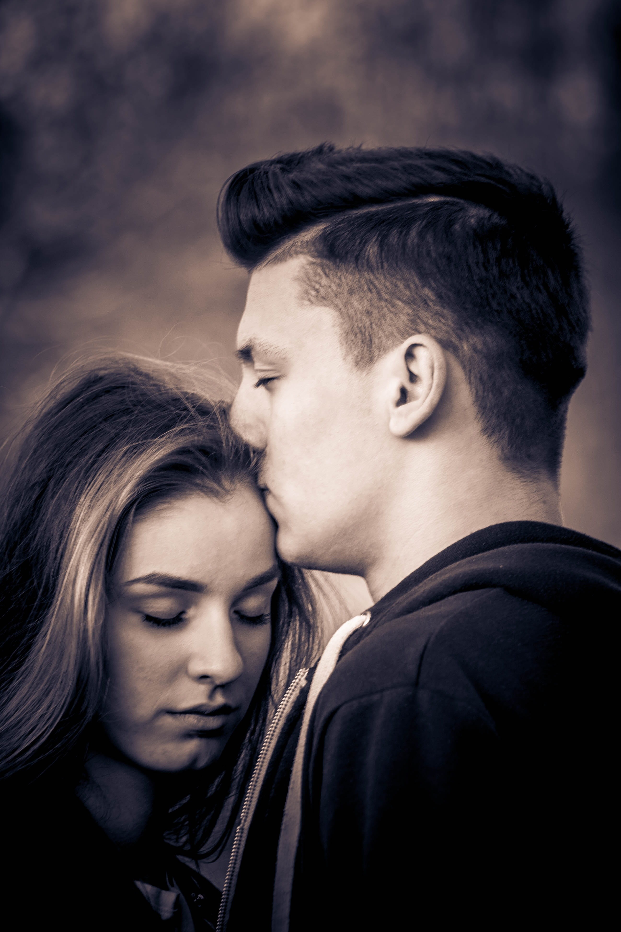 hairstyle, young Adult, heterosexual Couple, real people, friendship, portrait, man, headshot, kiss, forehead, adolescence, love, black and white, casual clothing, Phone HD Wallpaper