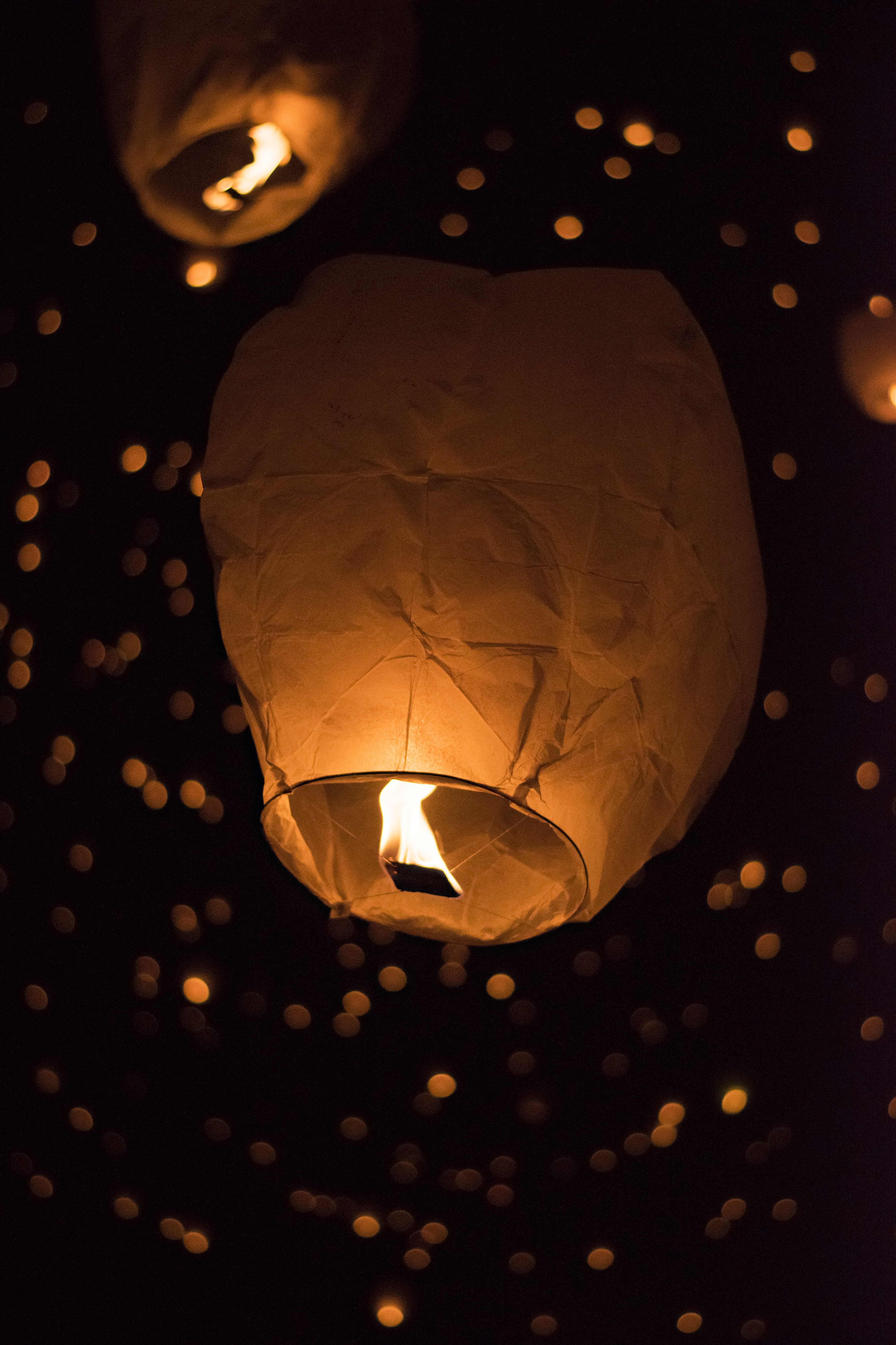 lighting equipment, crowd, lampshade, lamp, event, light, bokeh, flame, sky, paper, art, night, hair slide, lantern festival, parachute, sphere, illuminated, Phone HD Wallpaper
