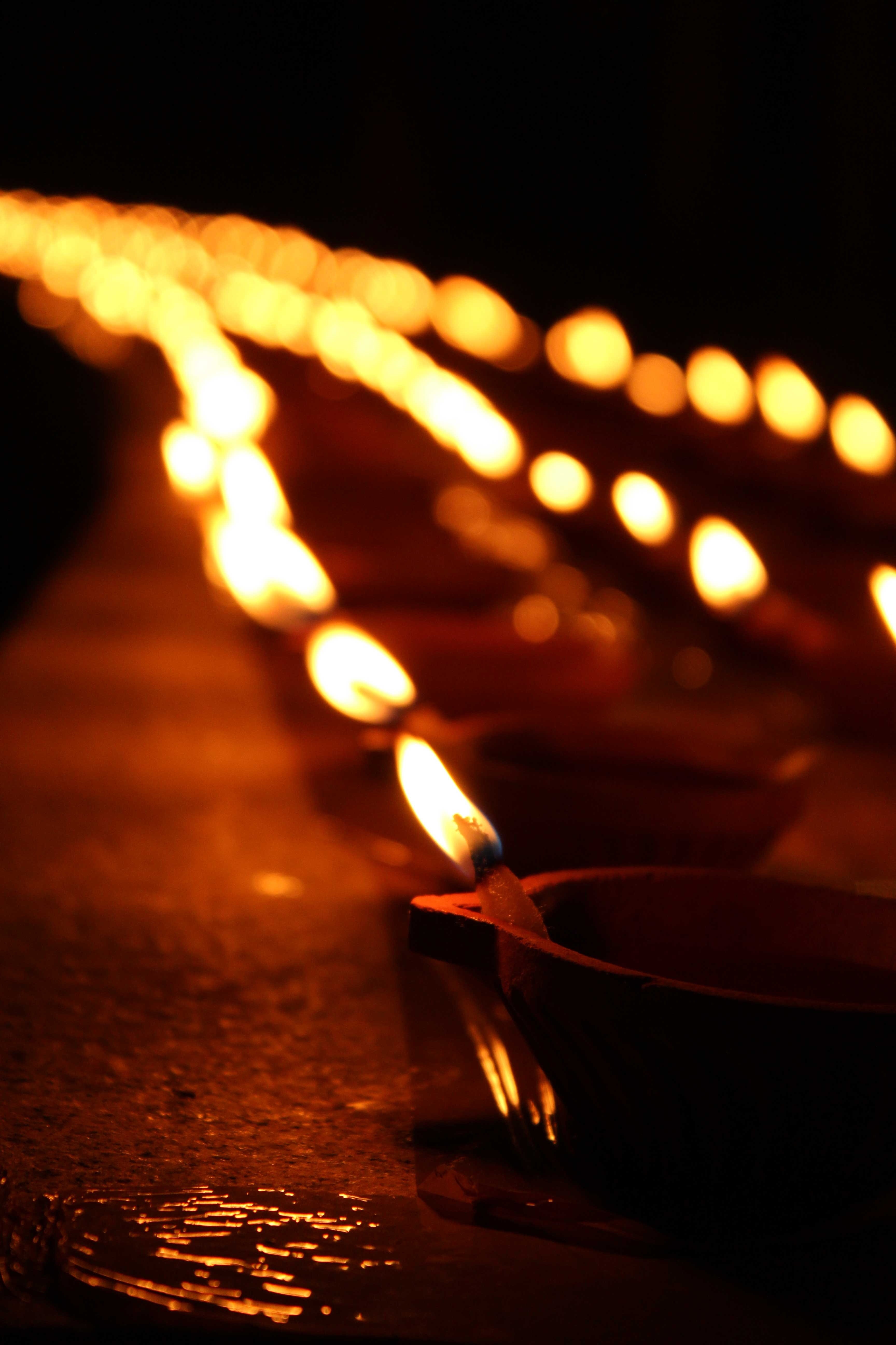 fire, tea light, selective, candle, glowing, dark, Candles, Diwali, flame, burning, lighted, fire - natural phenomenon, oil lamp, focus, in a row, close-up, Phone HD Wallpaper