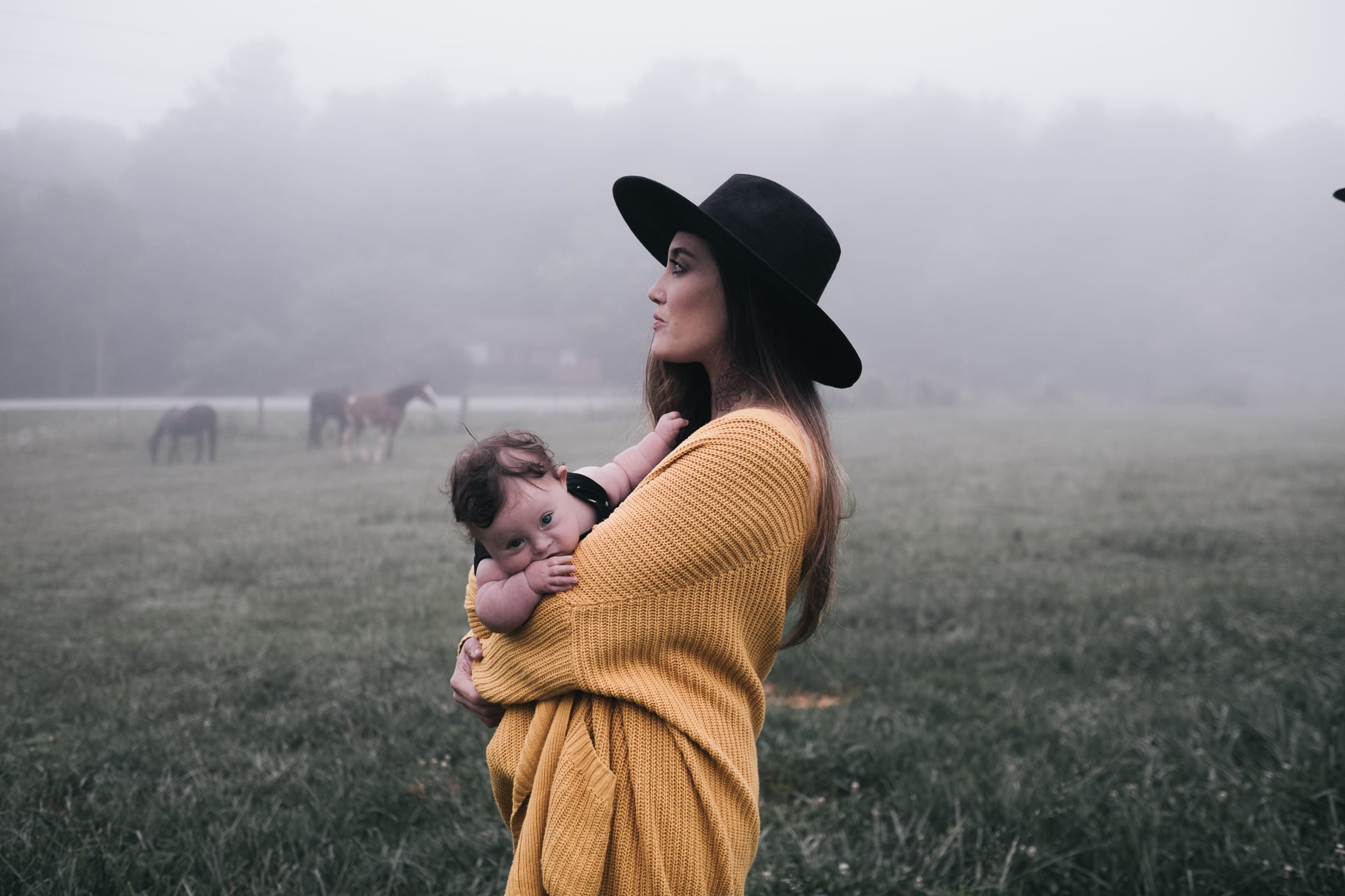 togetherness, grass, standing, color Image, men, lifestyles, two People, black, baby, field, real people, black sun, hat, smiling, 1080P, land, embracing, HD Wallpaper