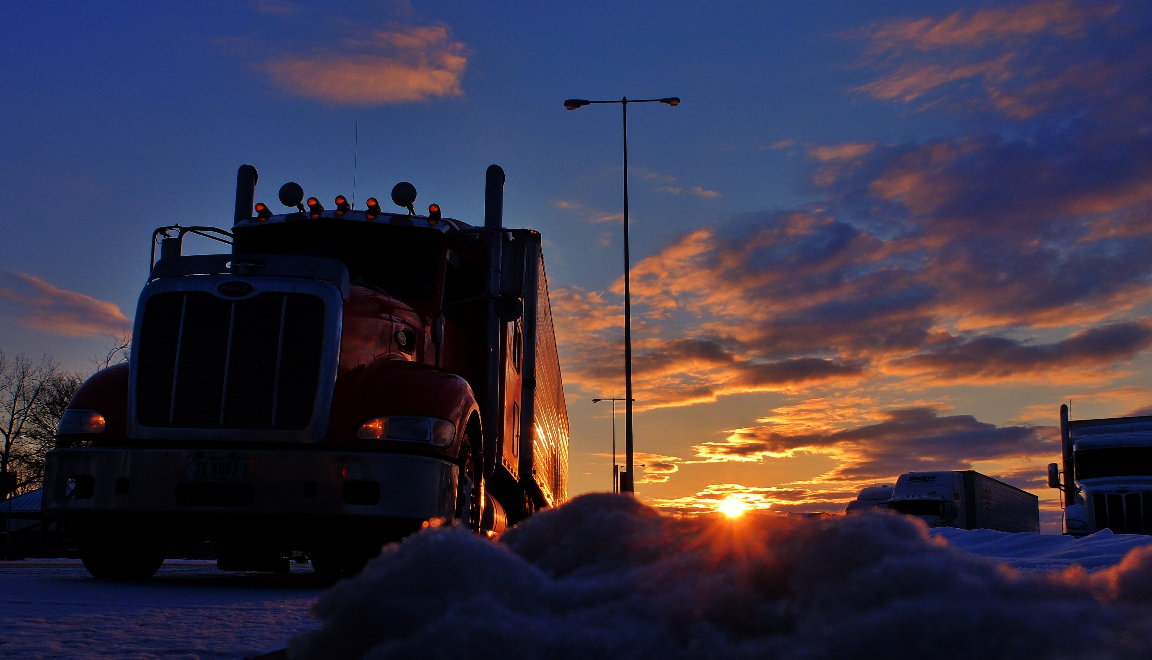 sunrise, motor vehicle, sunshine, nature, shipping, transport, trucker, orange color, mode of transportation, industry, heavy, street, 2K, dusk, cloud - sky, HD Wallpaper
