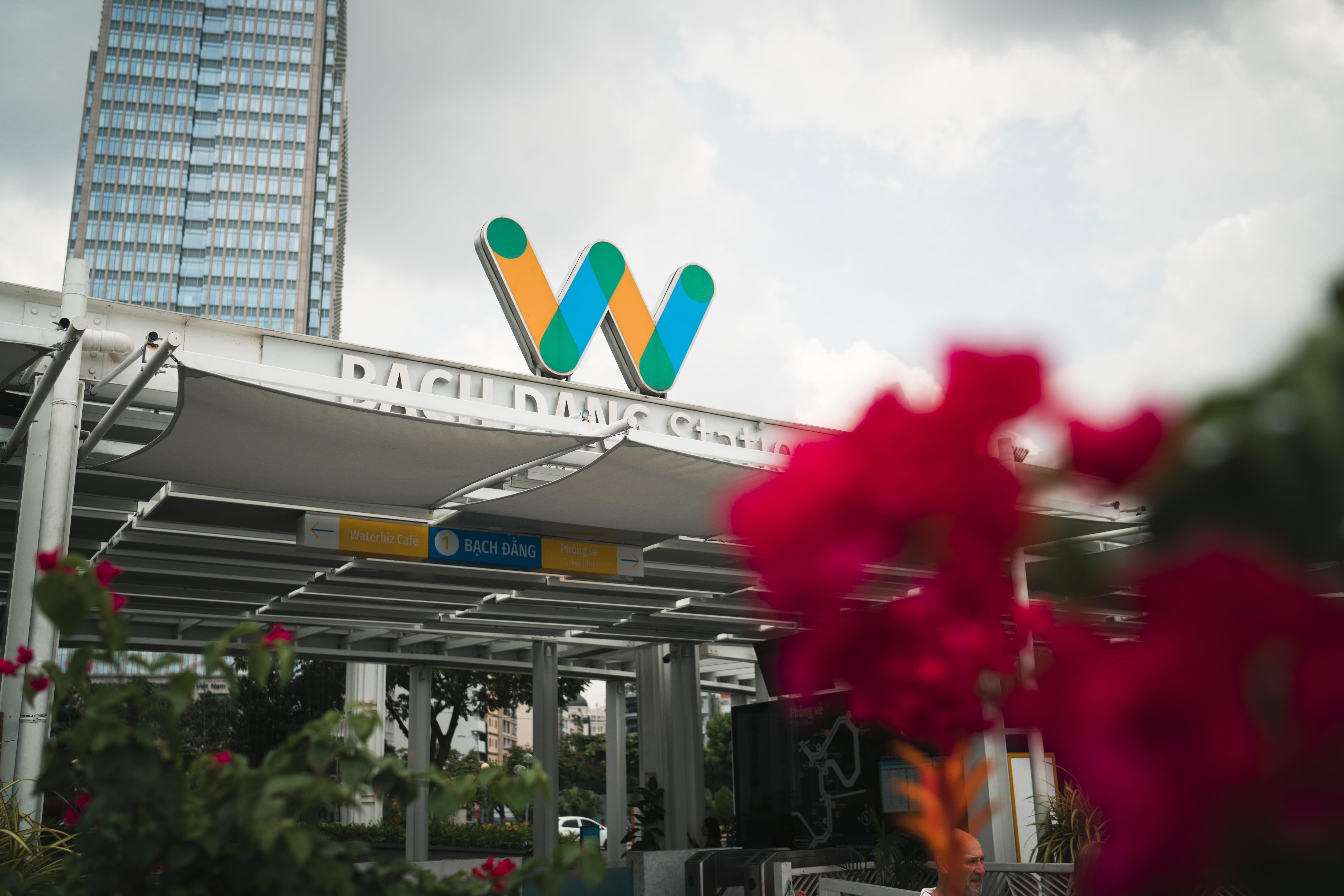 public transportation, building exterior, western script, no people, outdoors, built structure, low angle view, station, sign, text, river, hochiminh, communication, HD Wallpaper