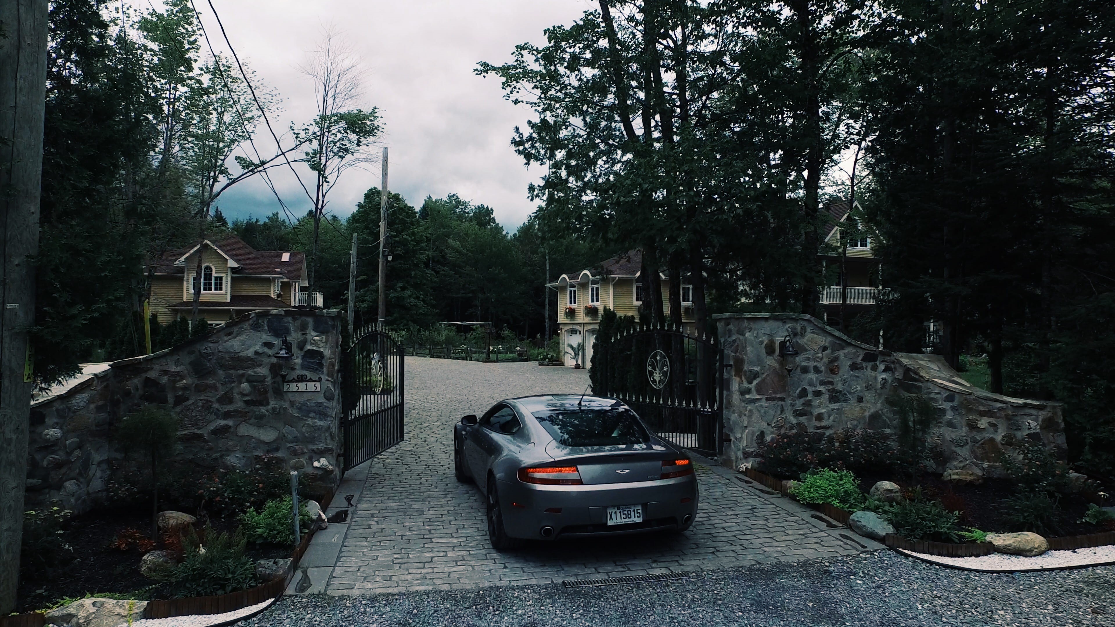film, city, building exterior, money, aston martin, road, architecture, day, built structure, drone, sky, lake memphremagog, no people, car, residential district, HD Wallpaper