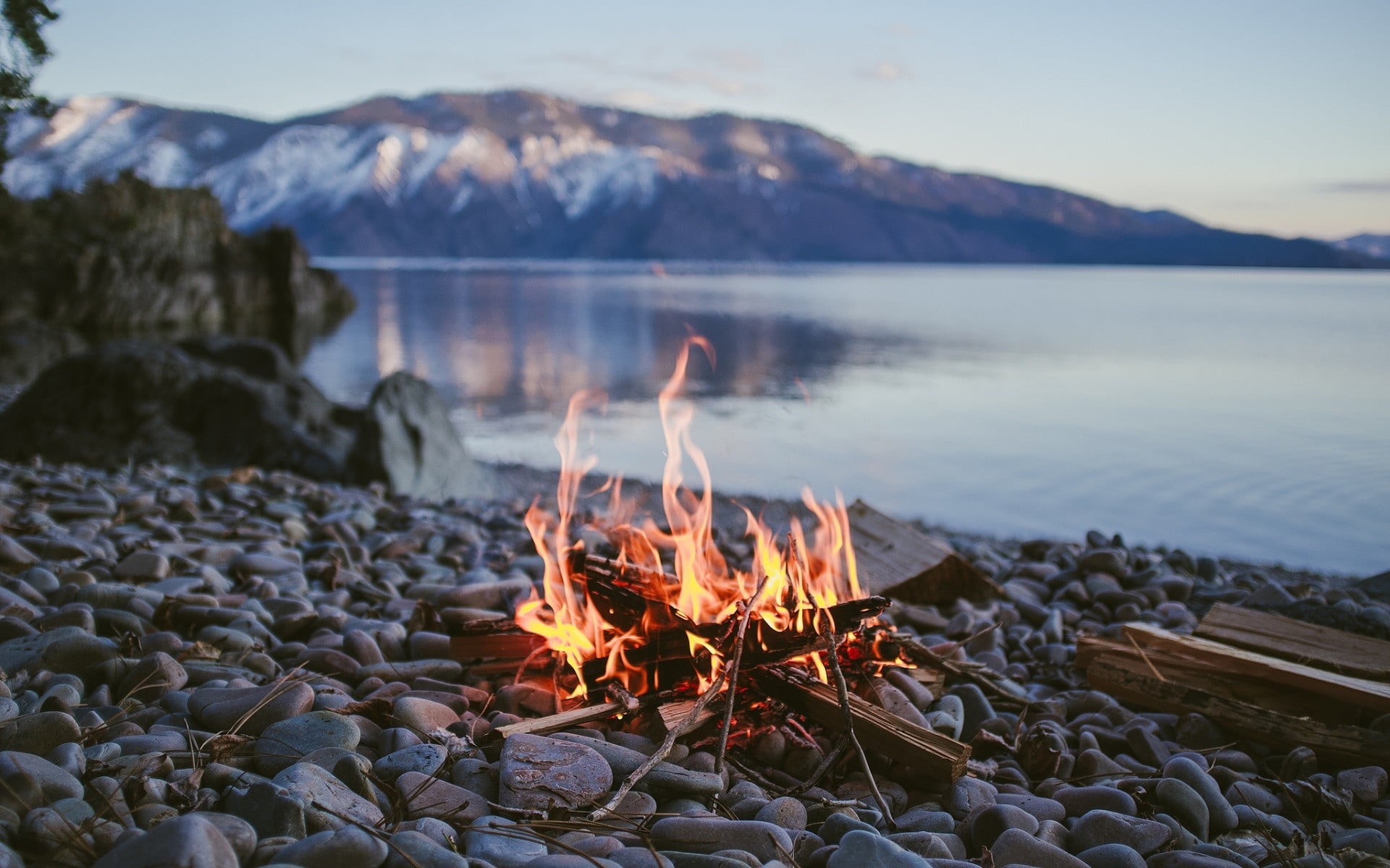 lake, brown, solid, stones, sky, focus on foreground, fire - natural phenomenon, flame, beauty in nature, outdoors, water, wood, rock, burning, tranquil scene, HD Wallpaper