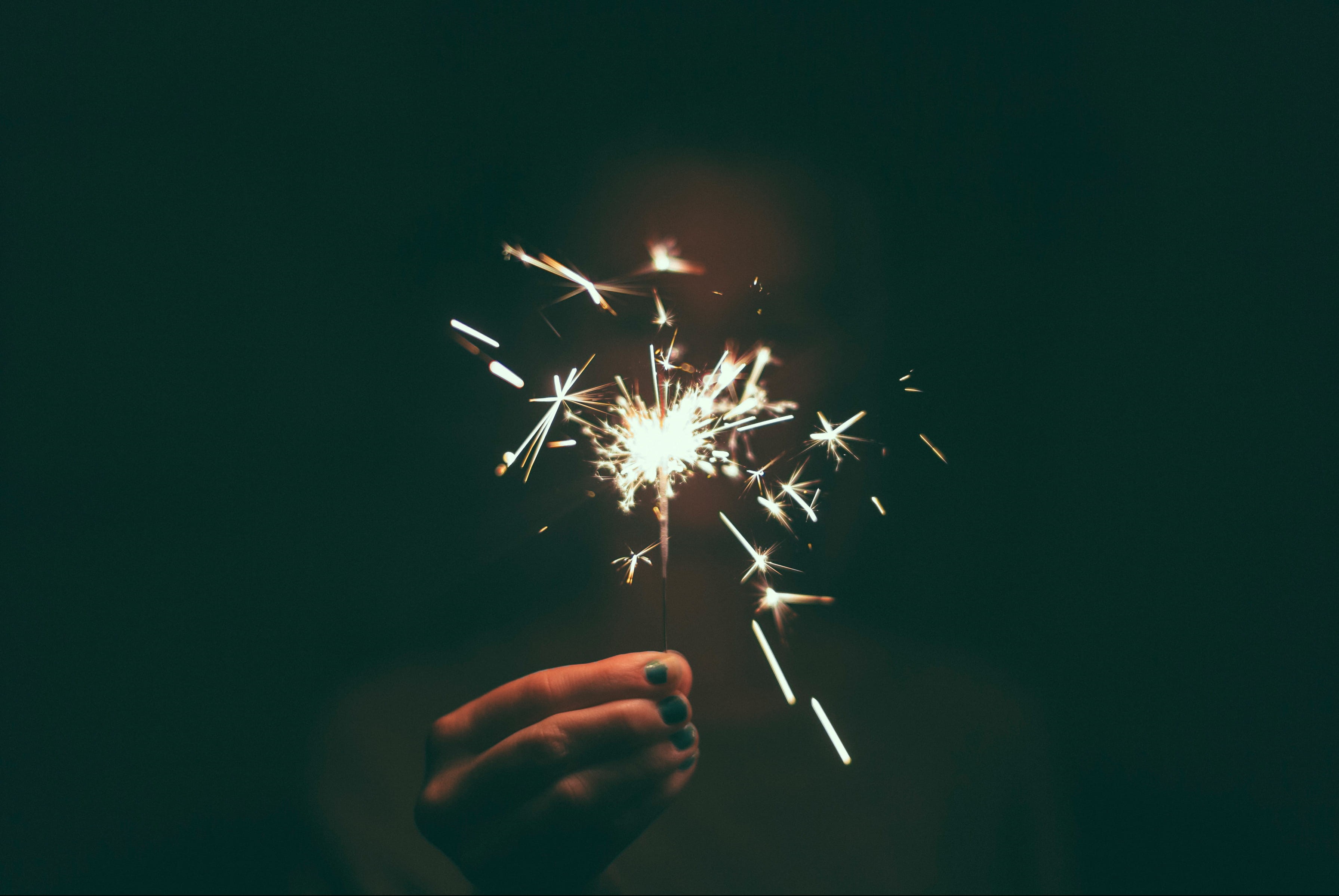 human Hand, unrecognizable person, blurred motion, firework Display, long exposure, arts culture and entertainment, 2K, real people, sparks, finger, hand, HD Wallpaper