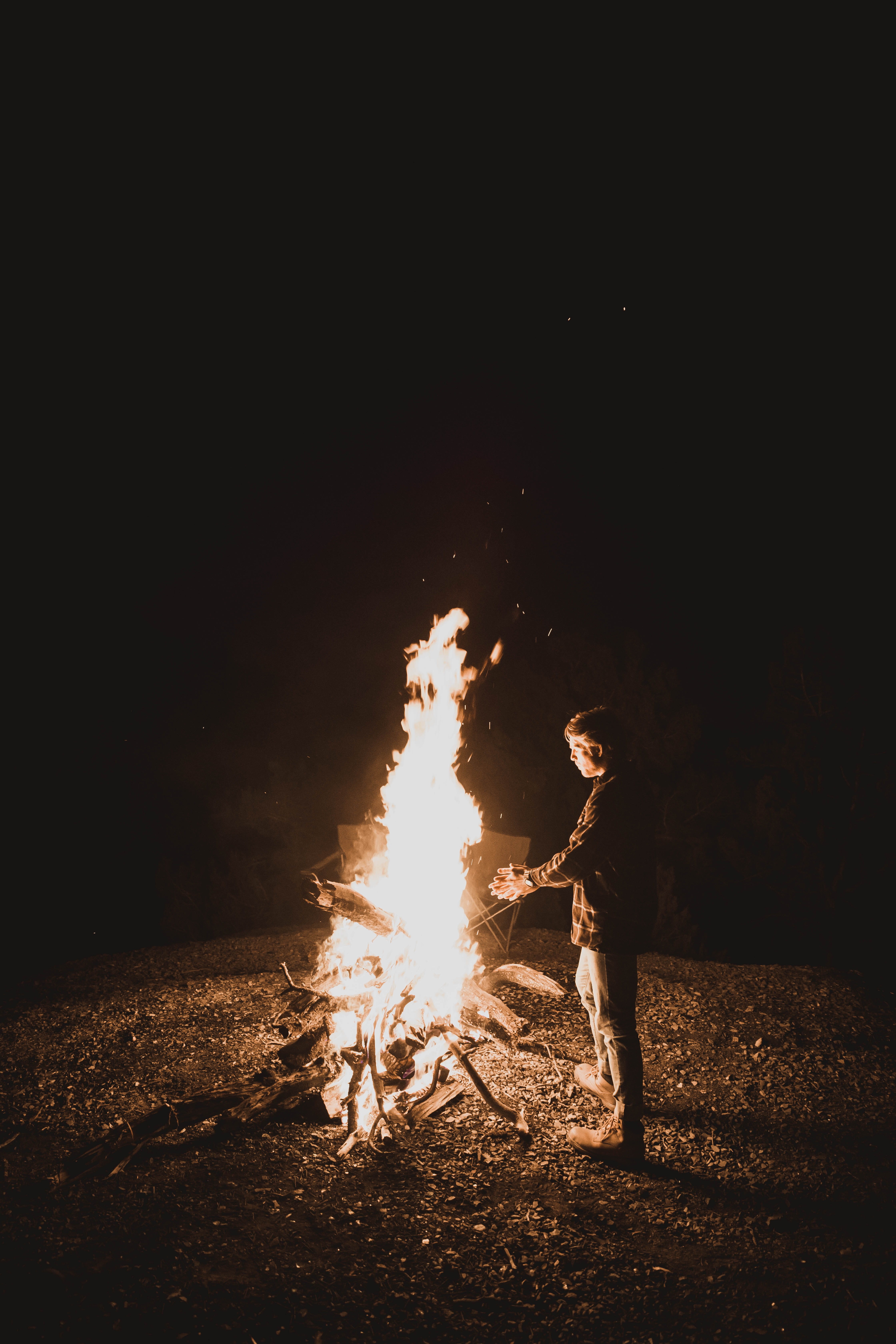 real people, fuego, togetherness, young adult, furniture, person, campfire, shorts, night light, fire, dark, near, 5K, men, light, human, night life, burning, Phone HD Wallpaper