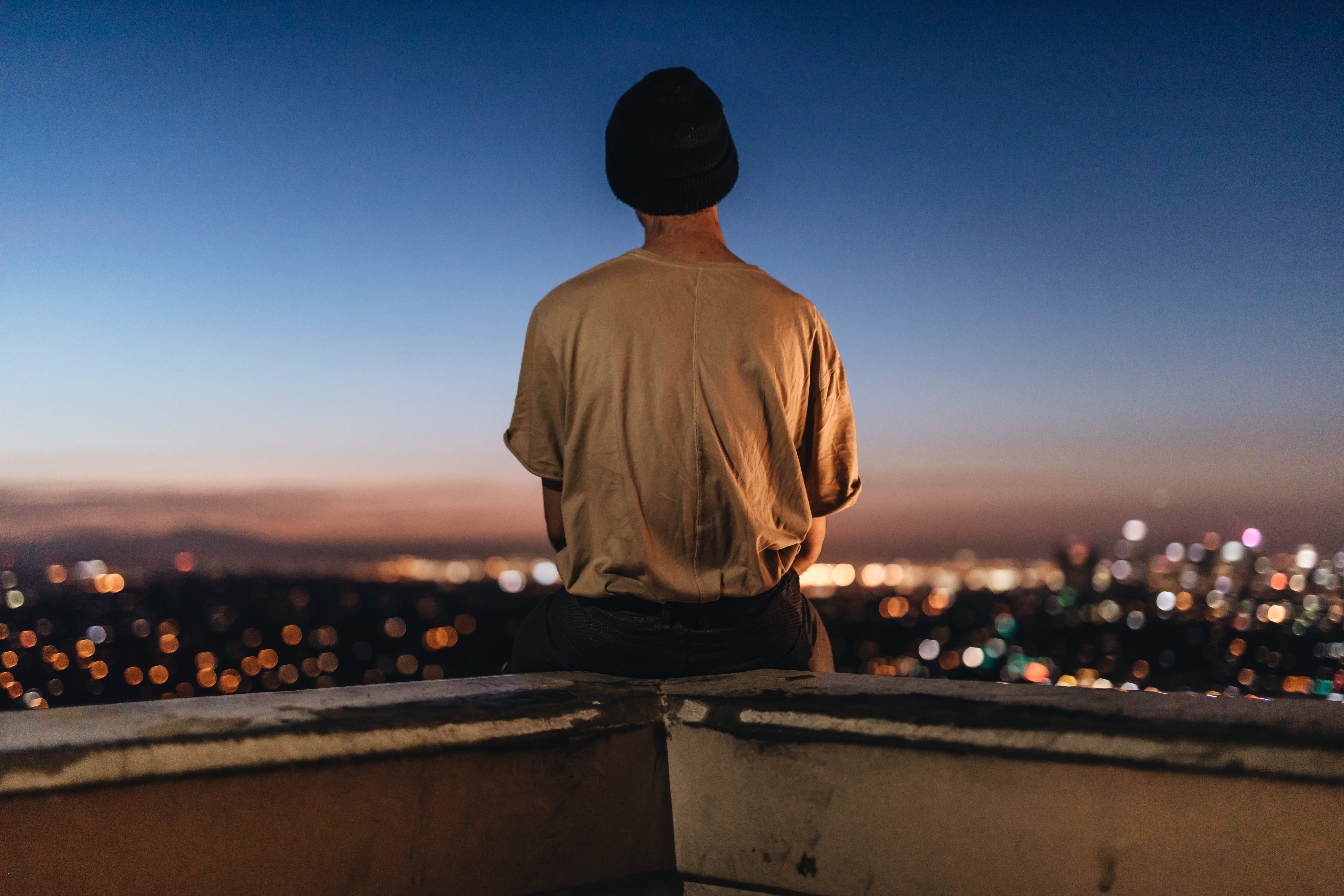 fence, looking, skyscraper, rooftop, real people, nature, city, illuminated, buildings, one person, night, ledge, focus on foreground, building exterior, HD Wallpaper