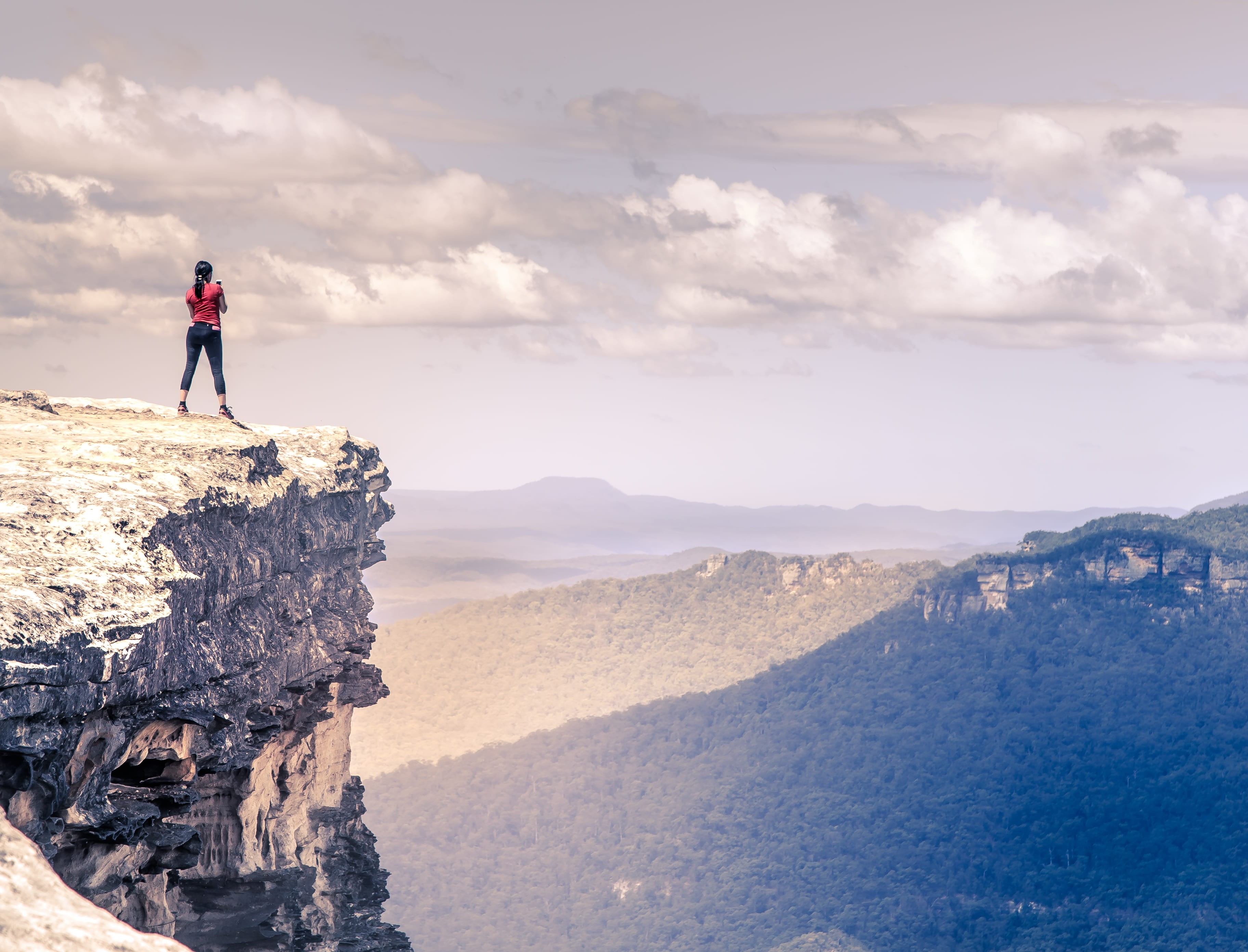 one person, cloud - sky, mountain, beauty in nature, outdoors, woman, edge, real people, full length, near, healthy lifestyle, rock - object, female, looking, HD Wallpaper