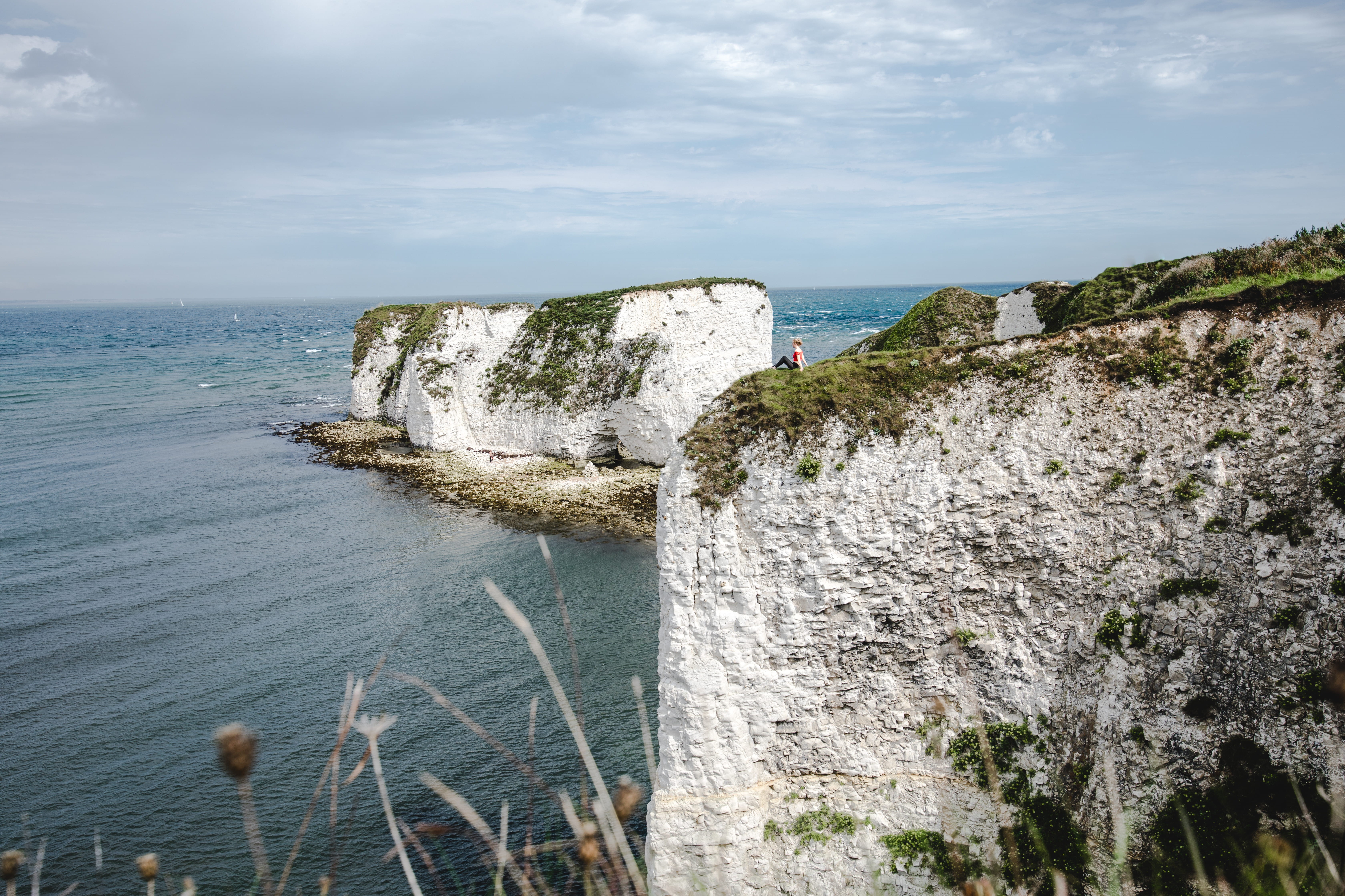 person, male, cliffs, cloud - sky, man, cliff, top, sea, old harrys rock, tranquility, outdoors, nature, ledge, rock, ocean, horizon, white, no people, HD Wallpaper