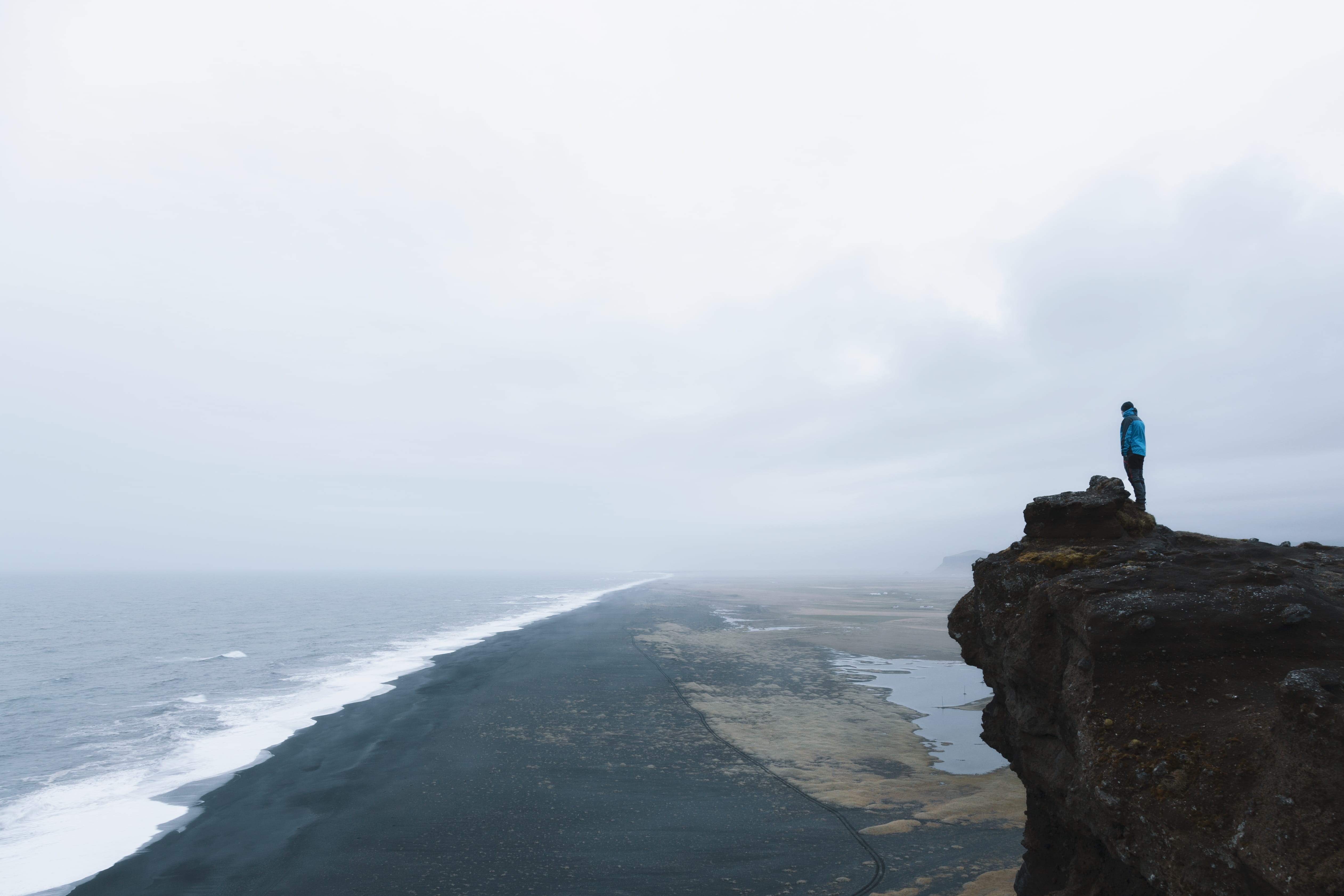 tranquility, water, beach, man, front, horizon over water, daytime, land, adventure, gray mountain, sky, 4K, sea, nature, rock, full length, solid, vacations, HD Wallpaper