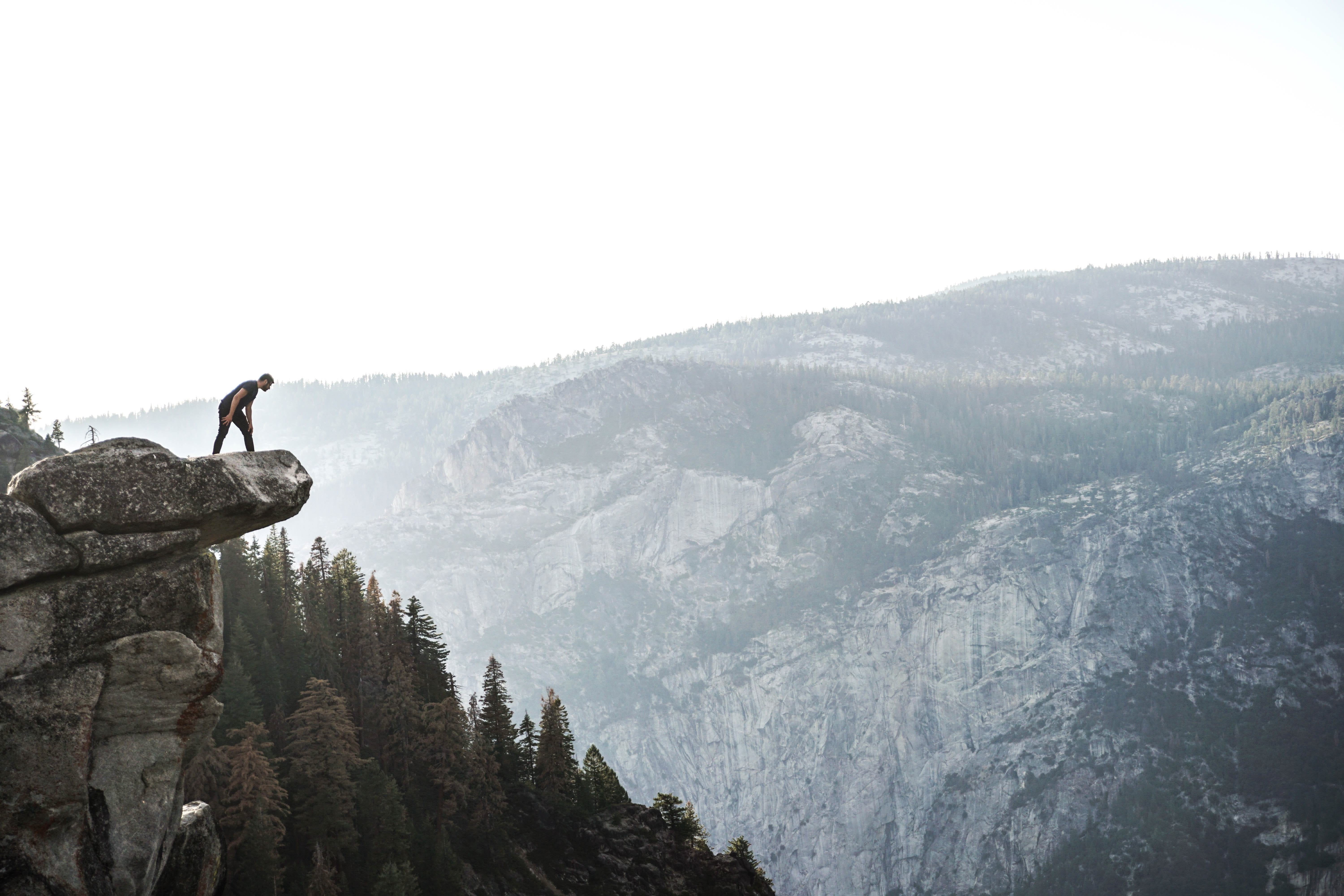 sky, wearing, men, scenics - nature, shirt, man, activity, outdoors, hiking, day, looking, edge, ledge, mountain, rock, forest, nature, real people, leisure activity, HD Wallpaper