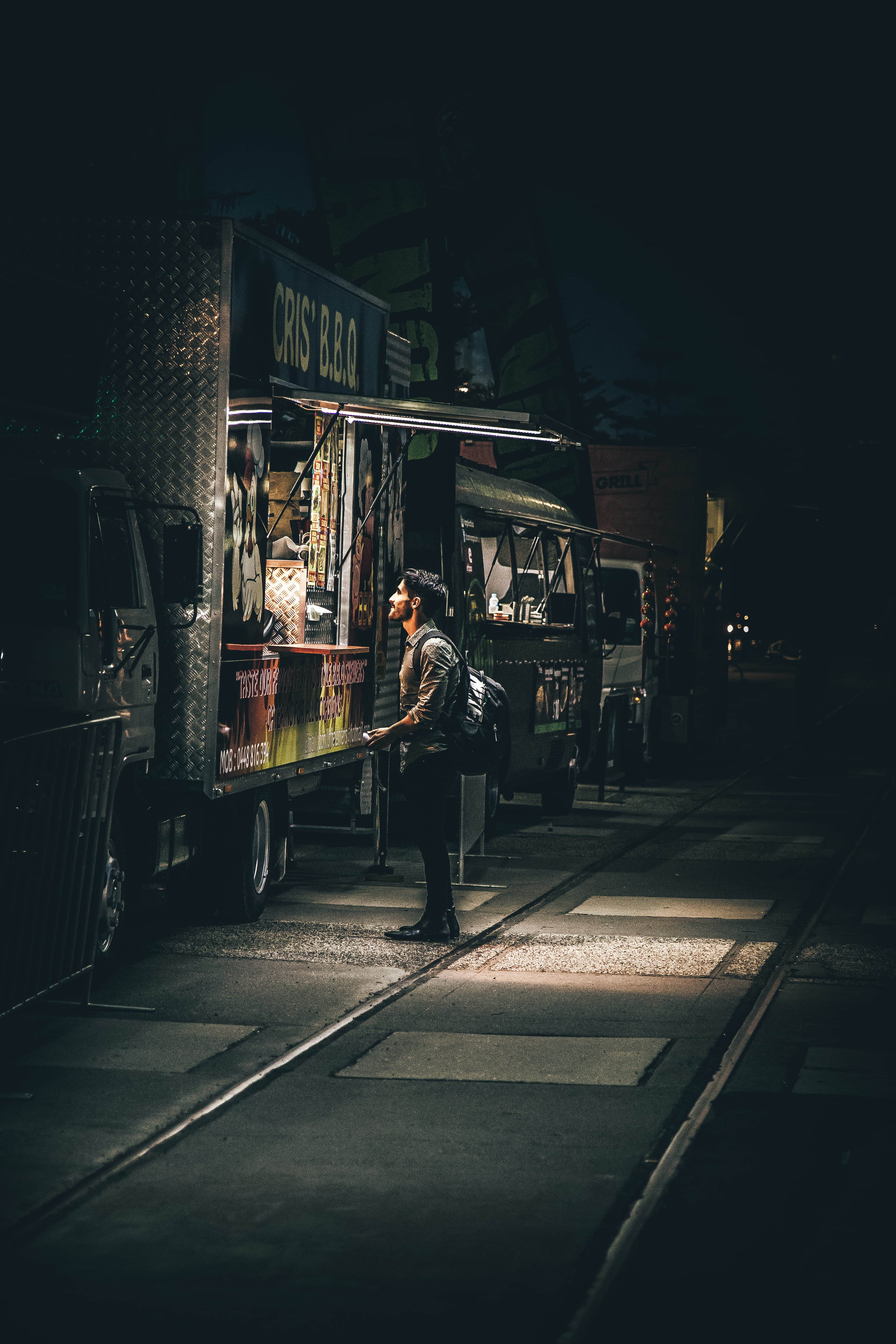 illuminated, shirt, rail transportation, people, travel, road, near, standing, car, land vehicle, b, backpack, truck, night, street photography, mode of Transport, Phone HD Wallpaper