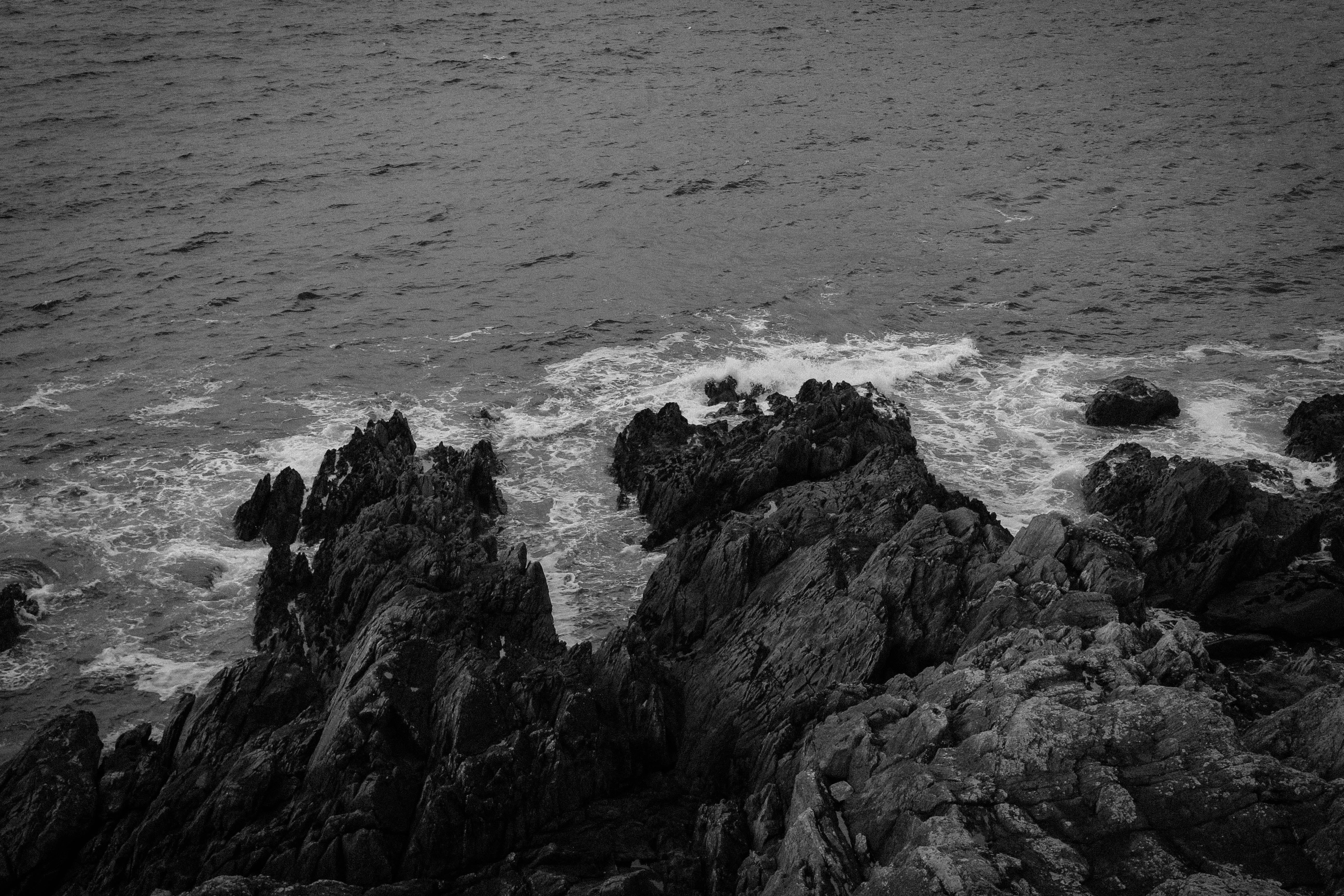 rock - object, rock, 5K, sea, tranquility, contemplation, water, waves, day, motion, land, dark, nature, wave, rock formation, outdoors, power in nature, HD Wallpaper