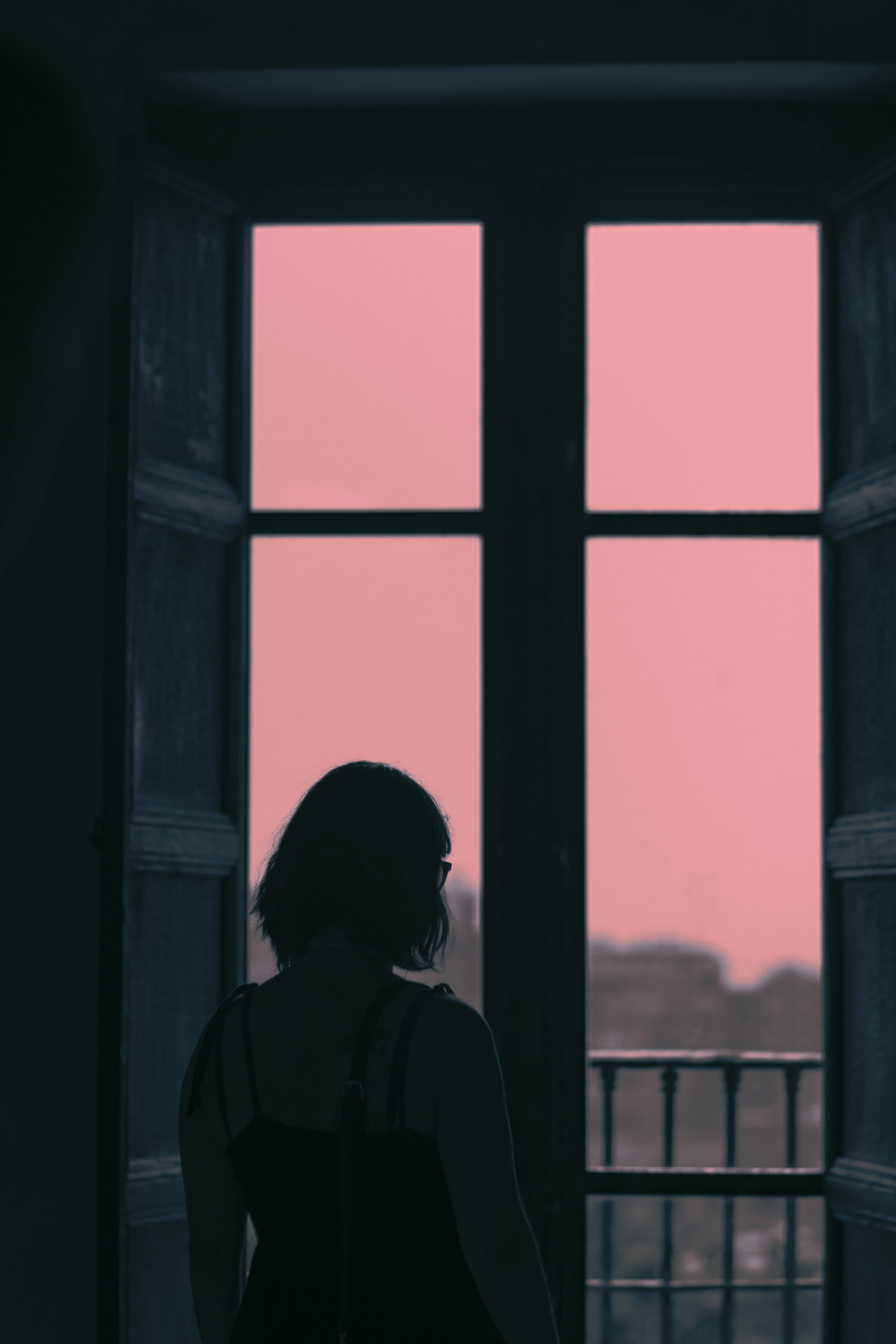 contrast, building Exterior, dark, 5K, looking out, female, evening, people, sky, girl, loneliness, observing, black Color, urban Scene, indoor, front, Phone HD Wallpaper
