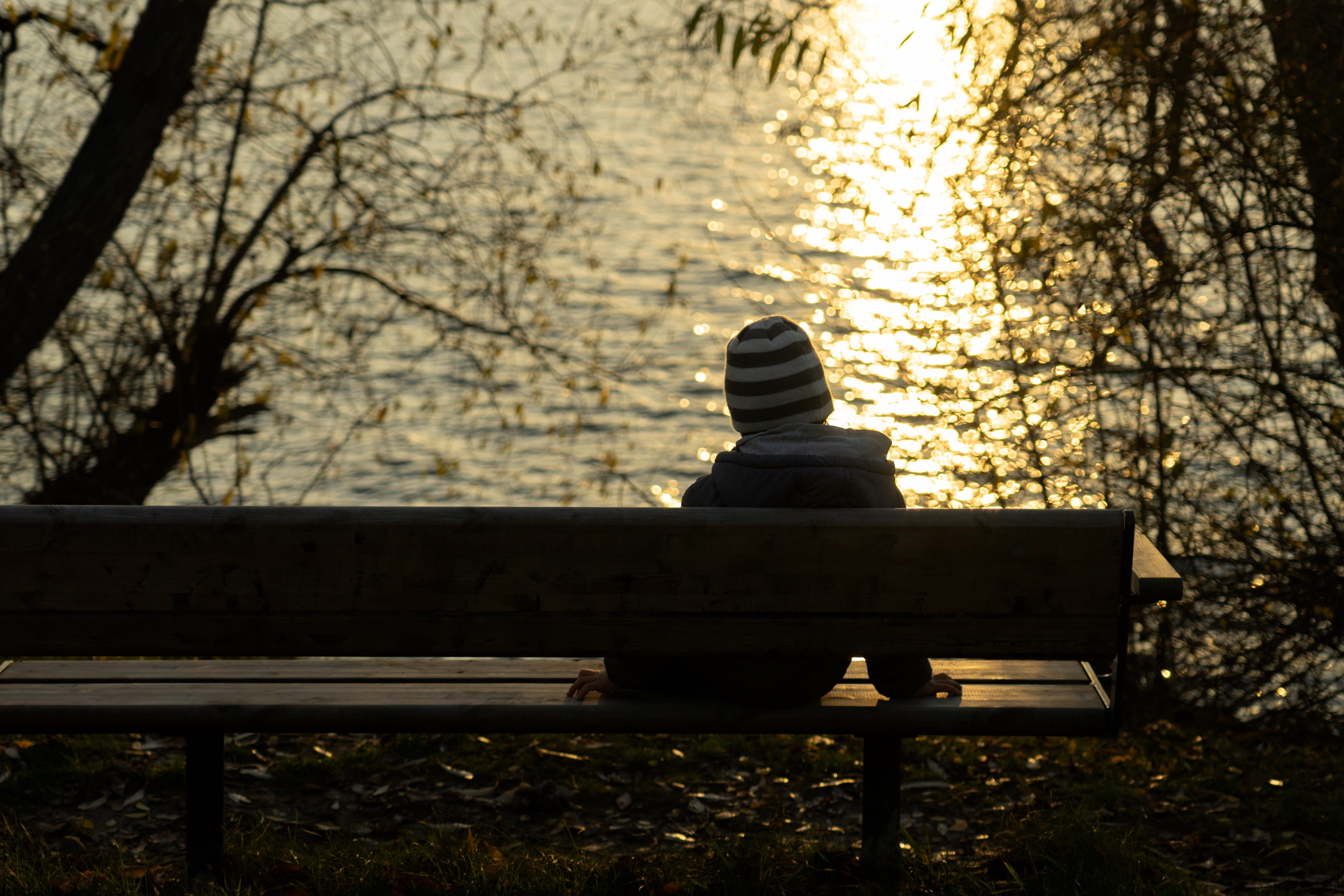 land, real people, child, lonely, park bench, tree, nature, warm clothing, bench, park - man made space, abandoned, one person, relaxation, sun, lifestyles, HD Wallpaper