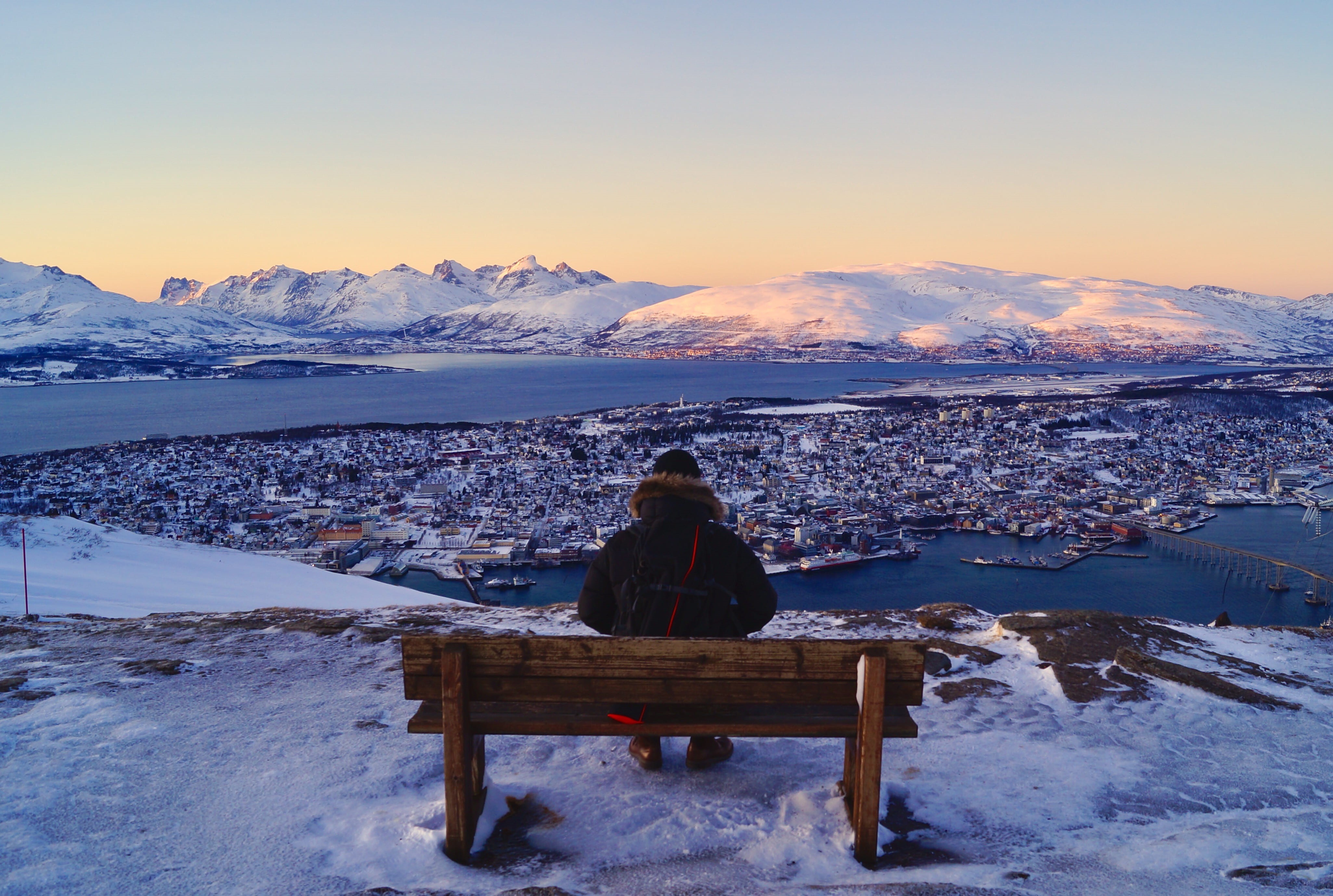 rear view, looking, person, sat, mountain, cold, water, winter, sun, front, one person, tromso, beauty in nature, tranquility, travel, sitting, adult, warm clothing, HD Wallpaper